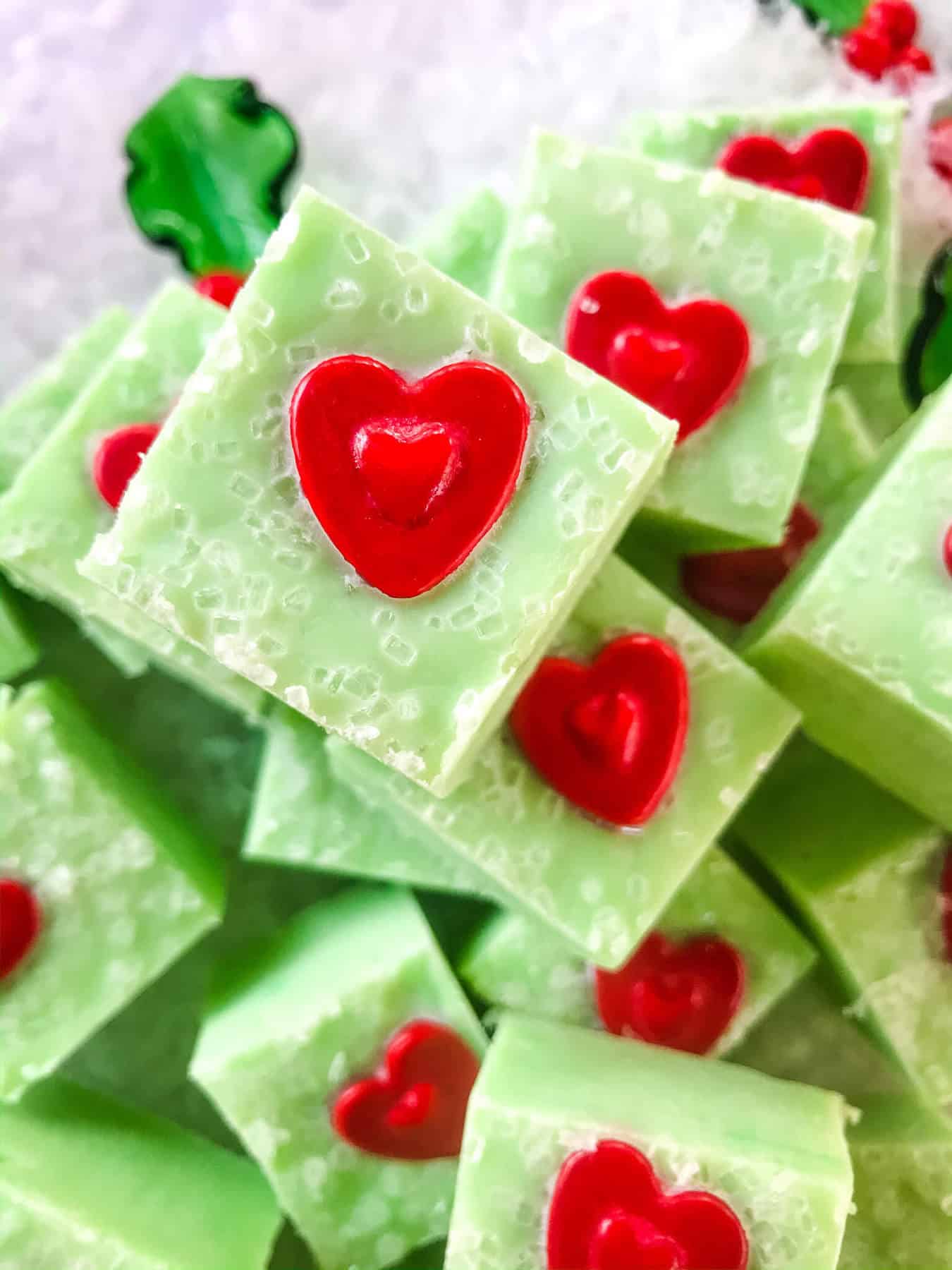 Green Grinch fudge with a red heat on each piece