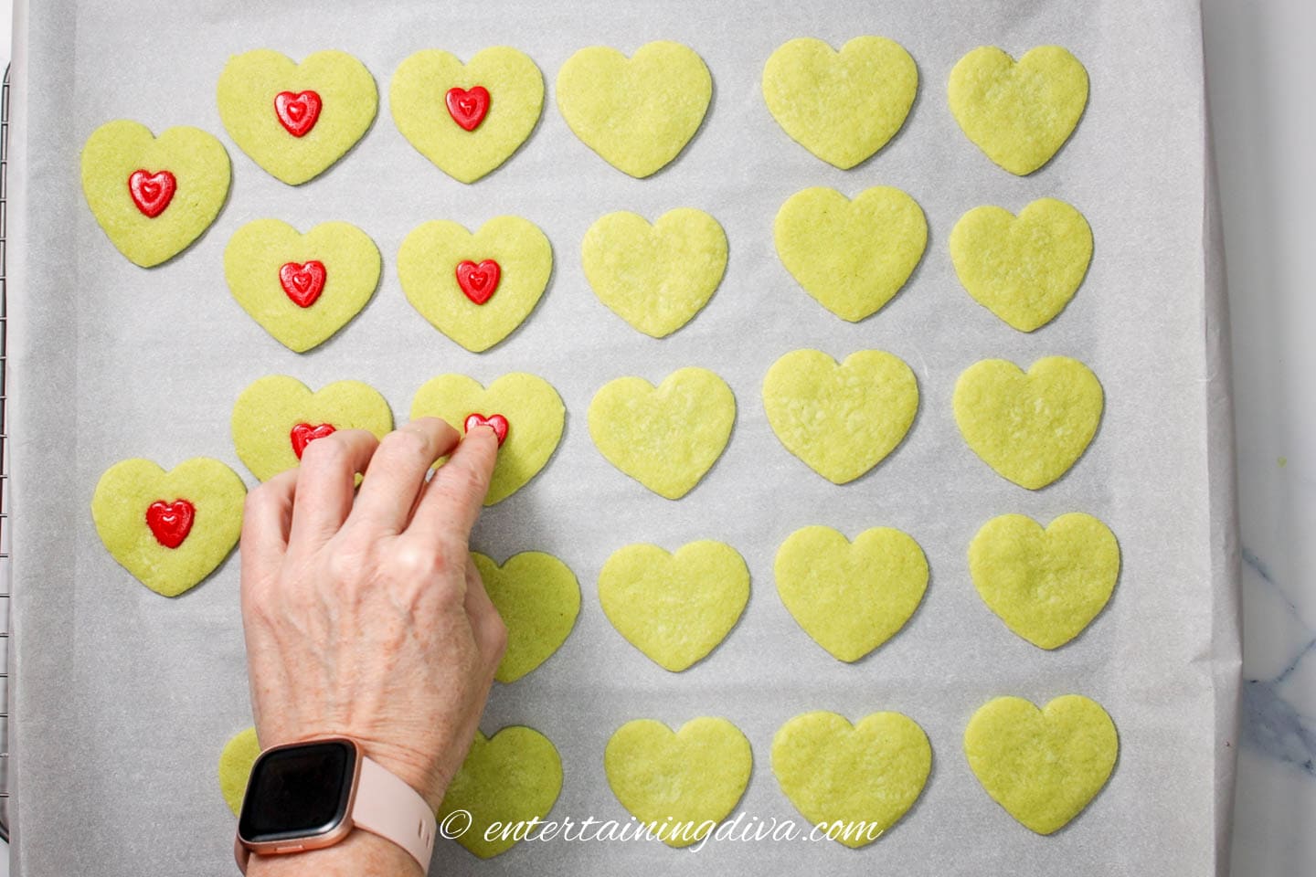 How to add the jumbo red heart sprinkle to the baked green heart sugar cookies