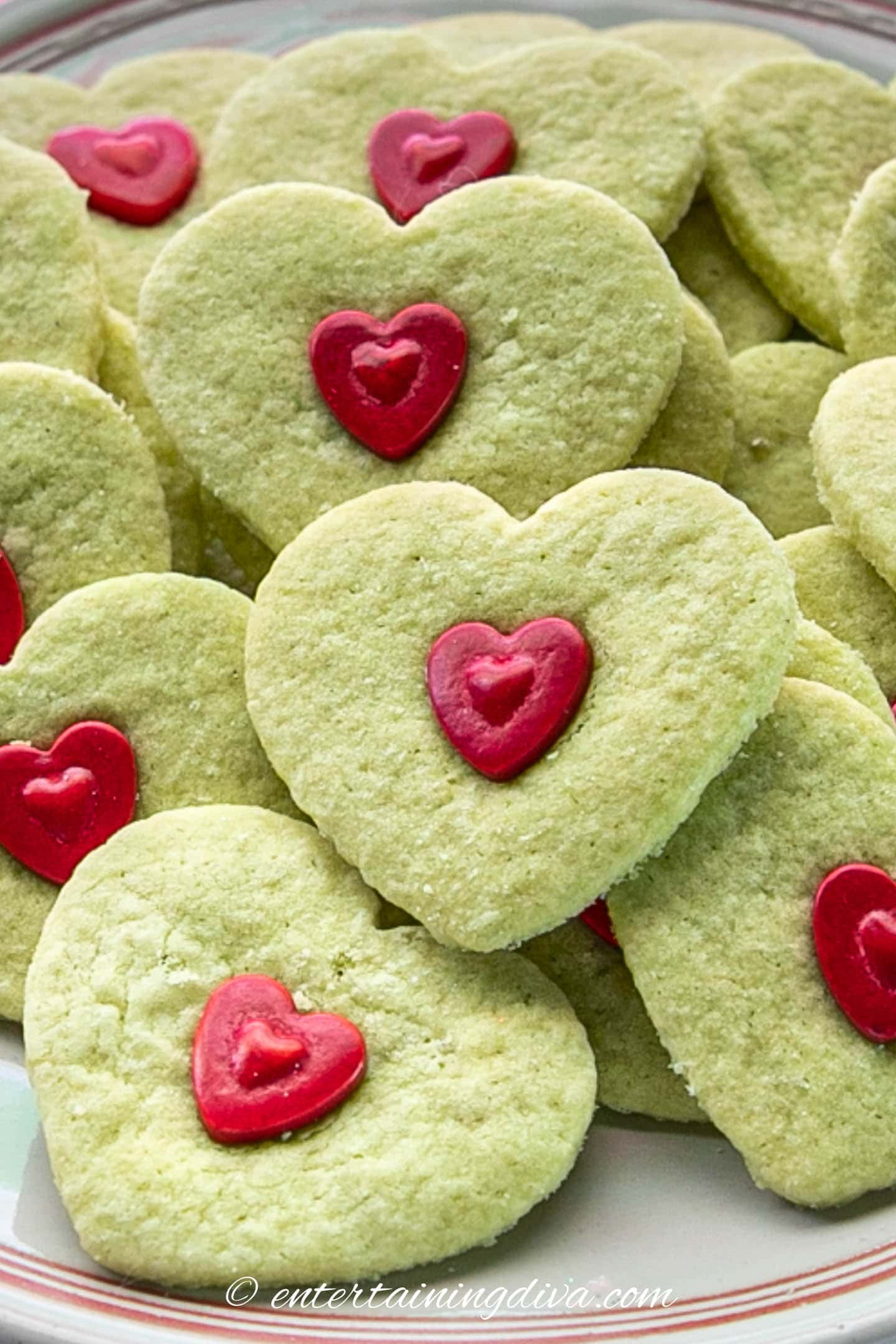 close up of green Grinch heart sugar cookies
