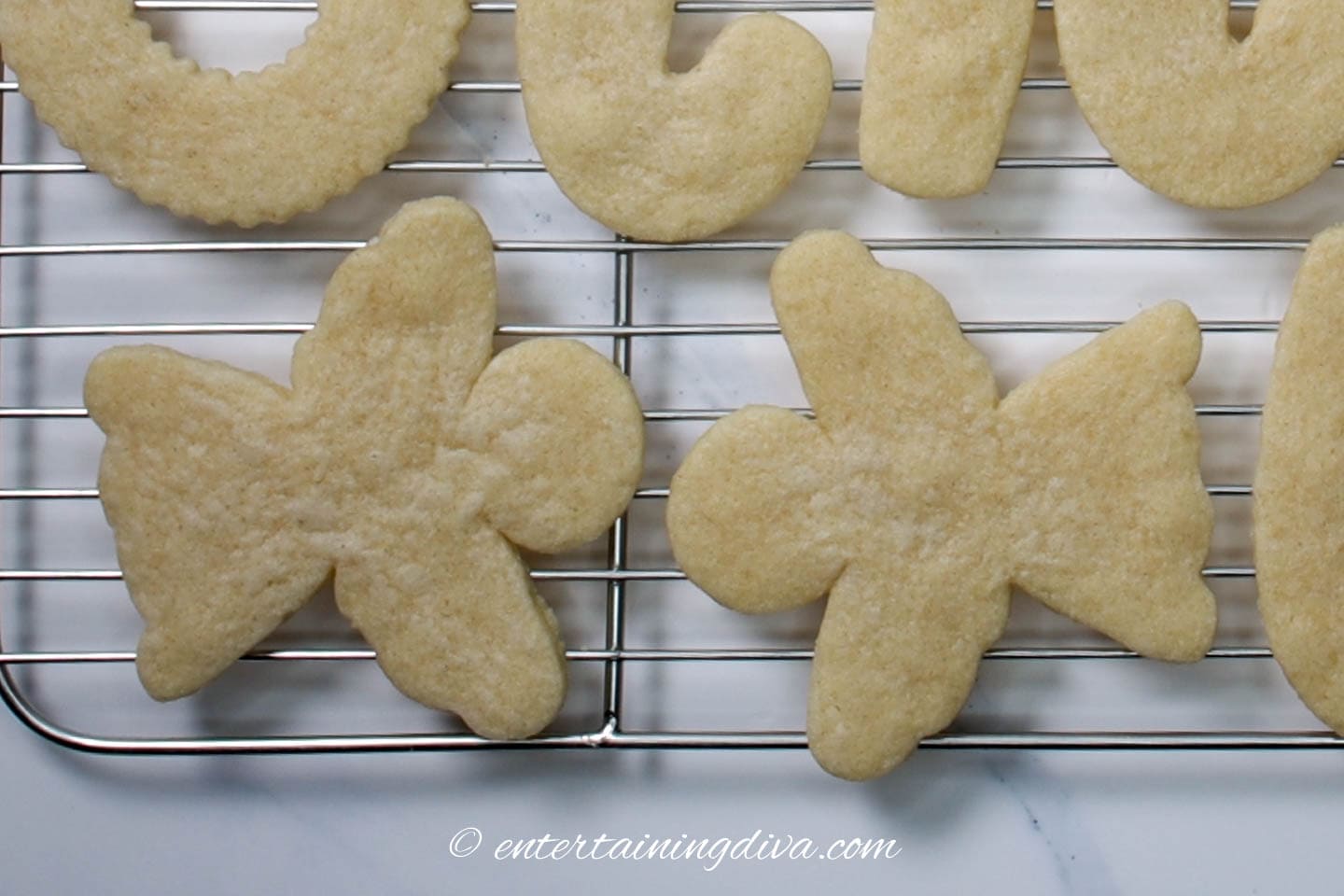 Christmas angel cookies on a wire cooling rack