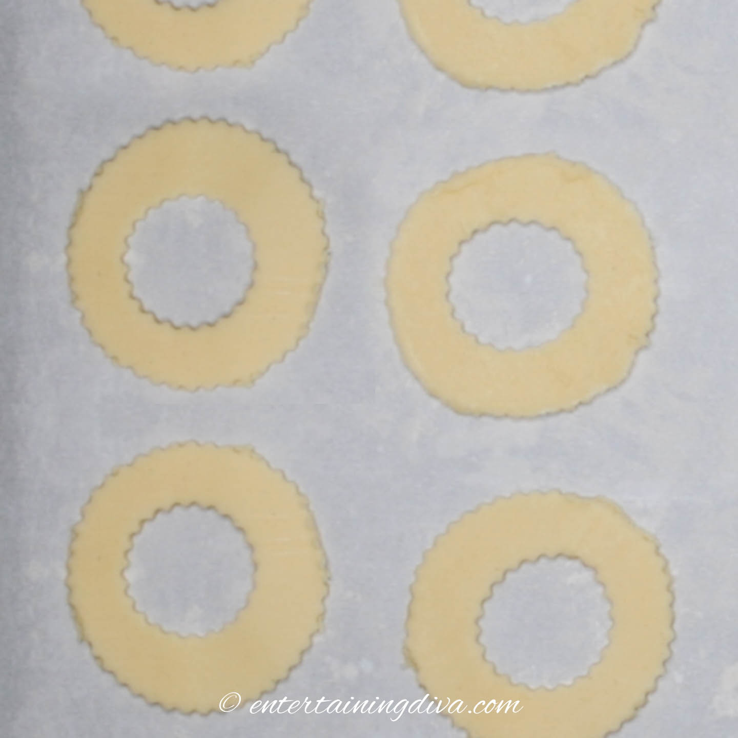 wreath cookies on a cookie sheet
