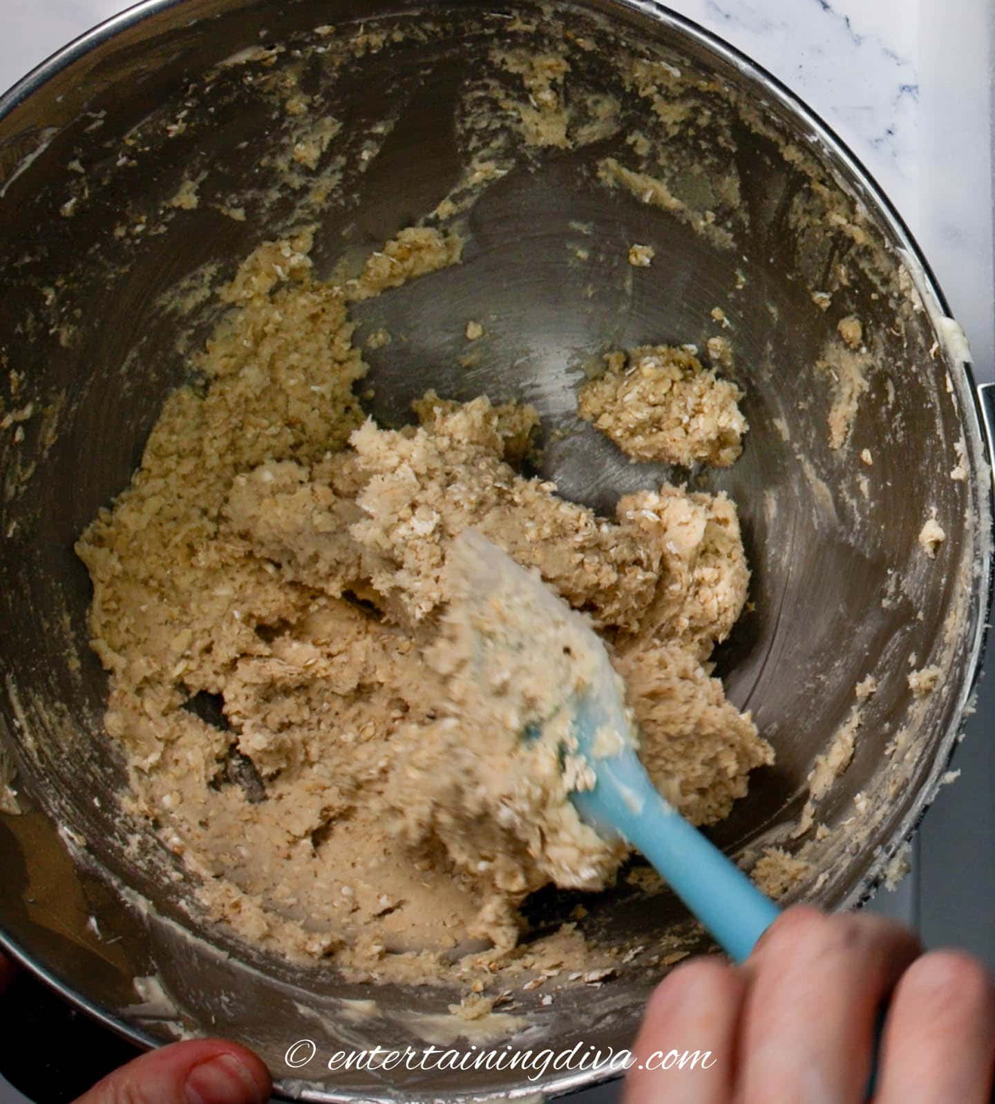 cookie dough being stirred with a spoon