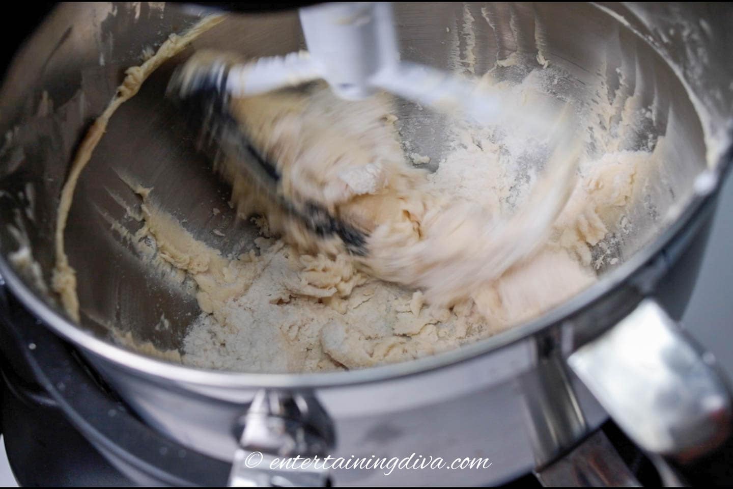 mixing cookie dough in an electric mixer
