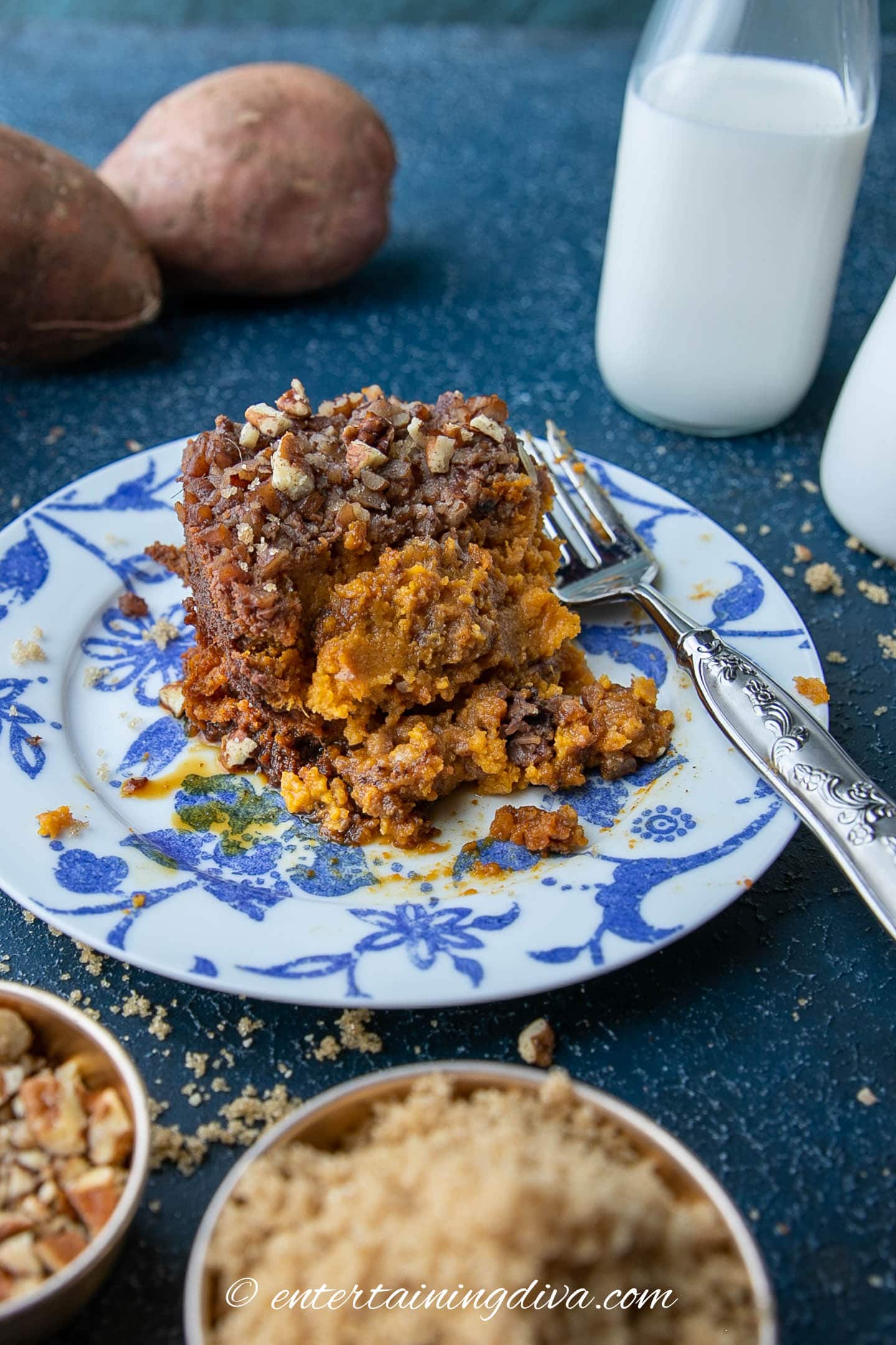 Sweet potato casserole on a plate with a fork