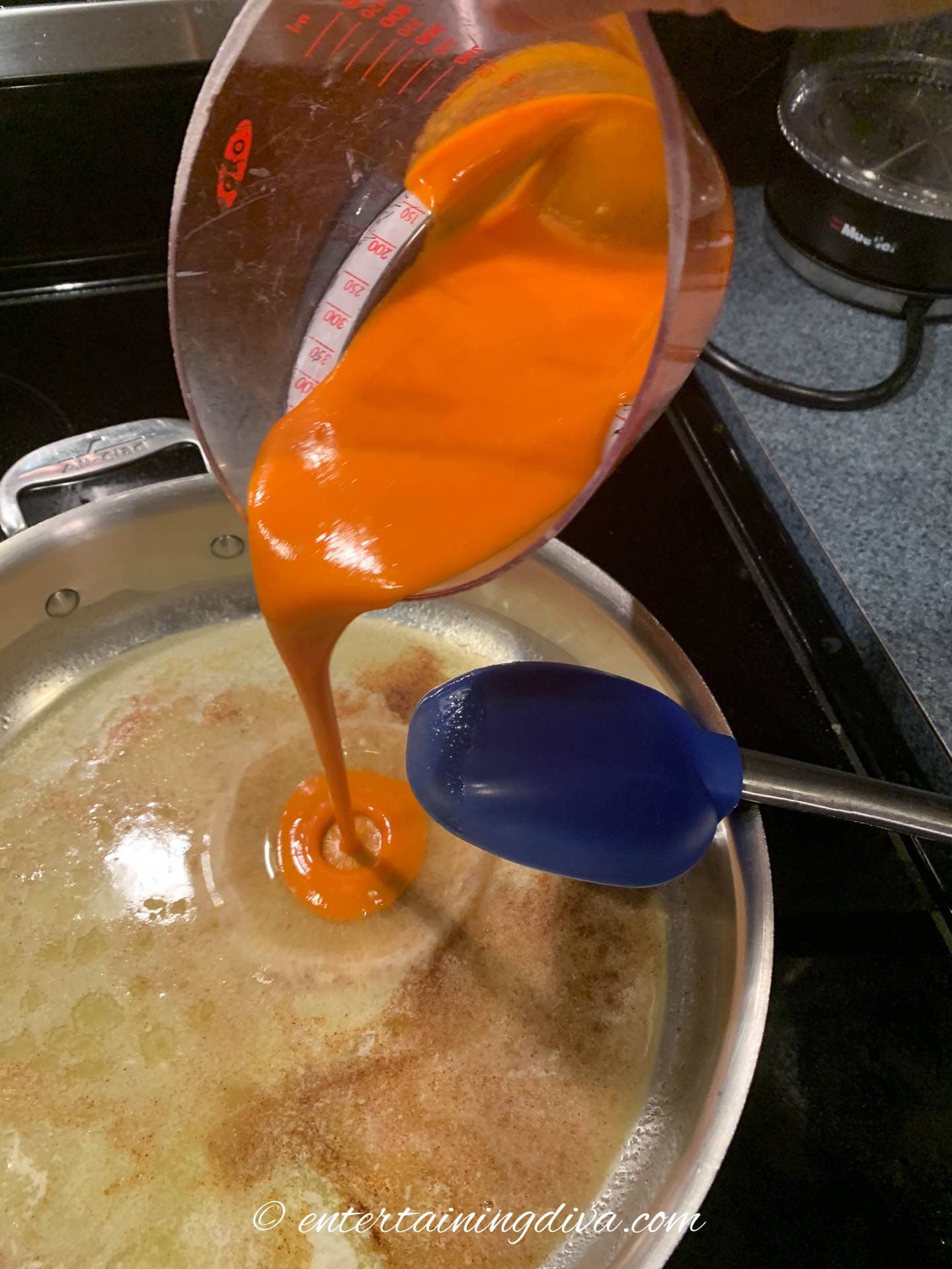 Frank's buffalo sauce being added to the melted butter