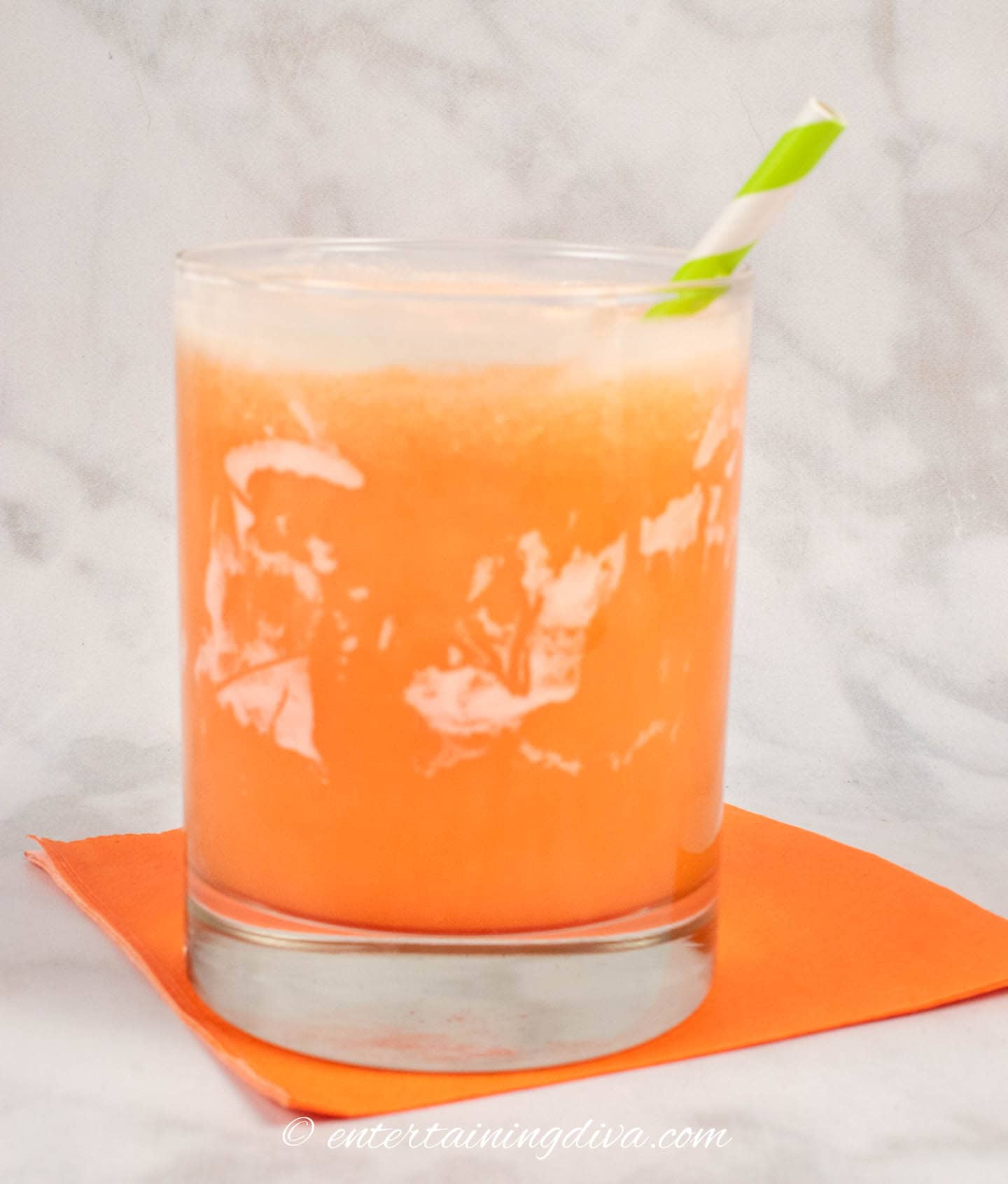 orange creamsicle cocktail made with whipped cream and orange soda