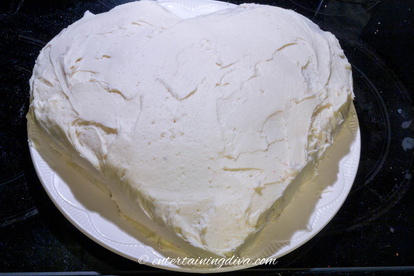heart shaped cake with white frosting