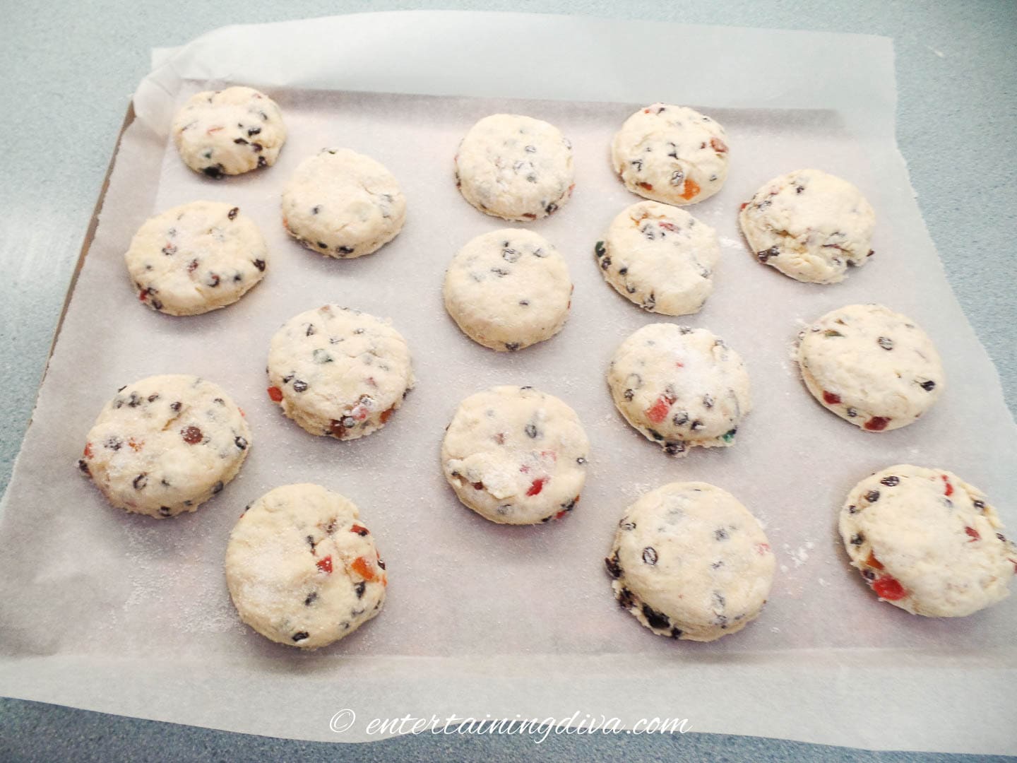round scones on a parchment paper lined baking sheet