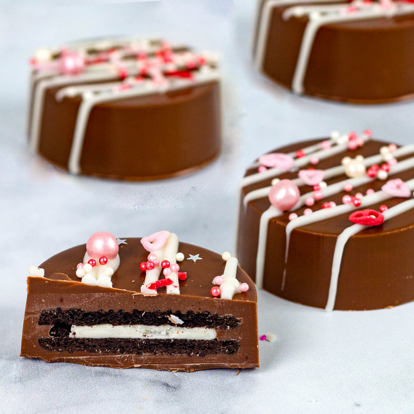 Valentine chocolate covered Oreos with pink sprinkles