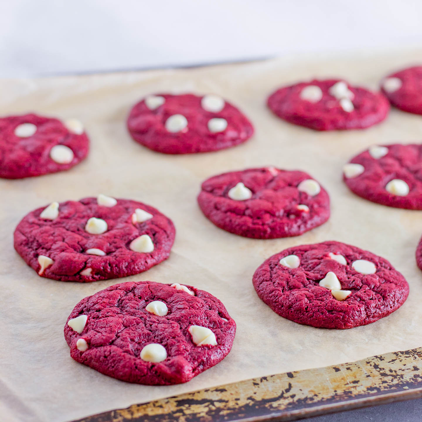 red velvet cake mix cookies on a cookie sheet after baking