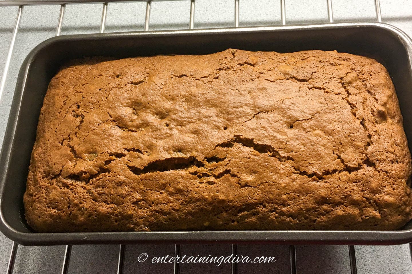 The baked old-fashioned date nut bread in a loaf pan
