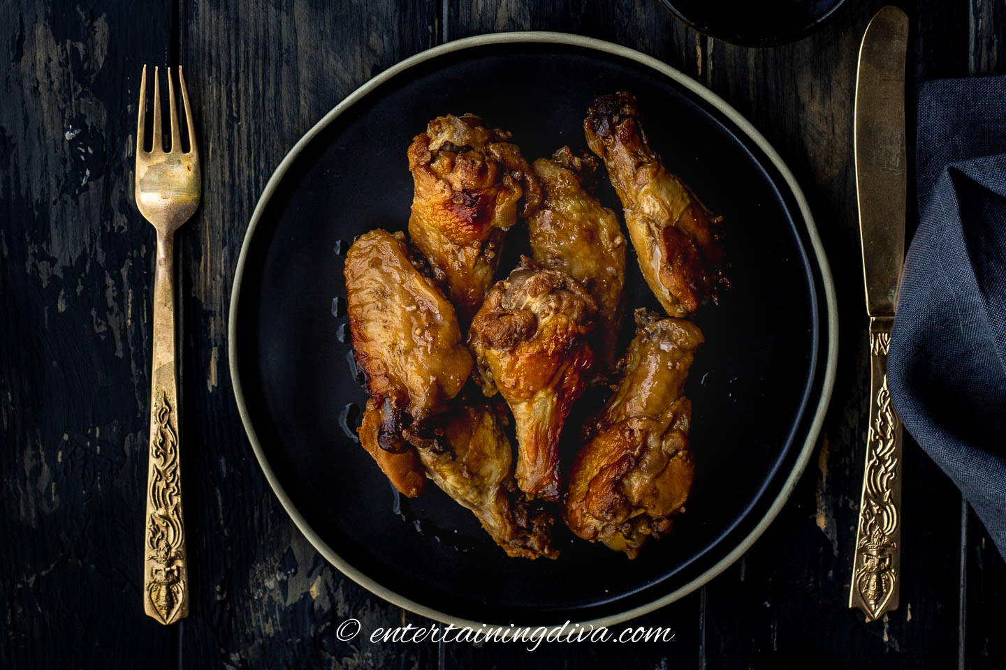 Easy baked sticky Chinese chicken wings on a plate