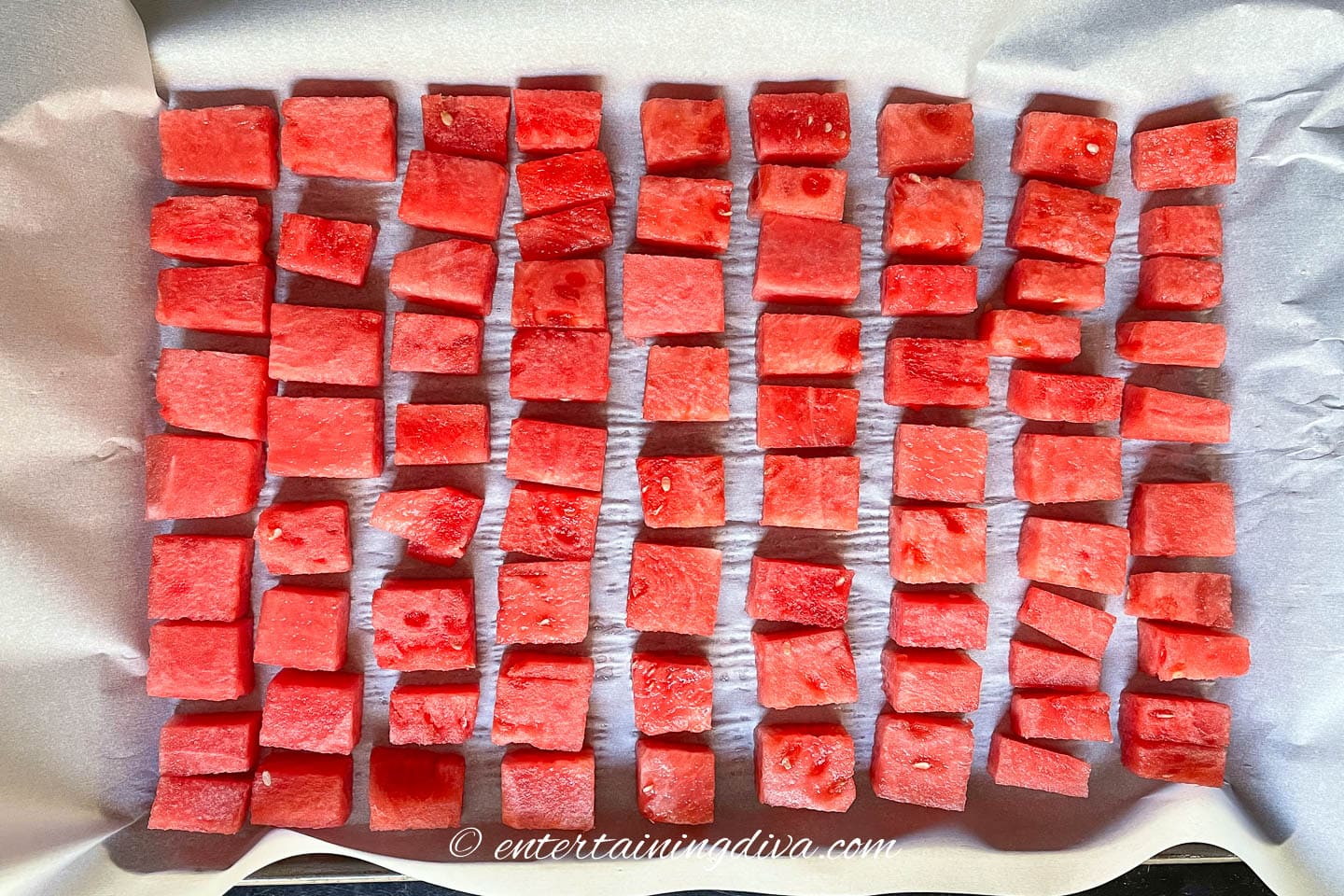 watermelon cubes on a cookie sheet