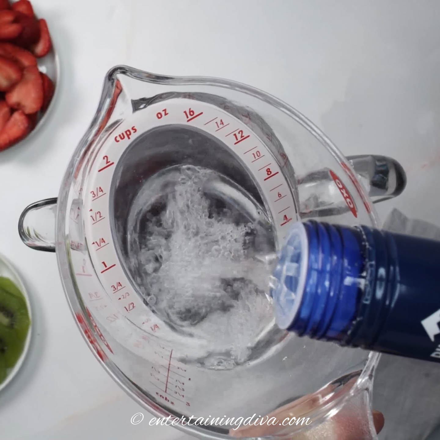 Vodka being poured into a measuring cup