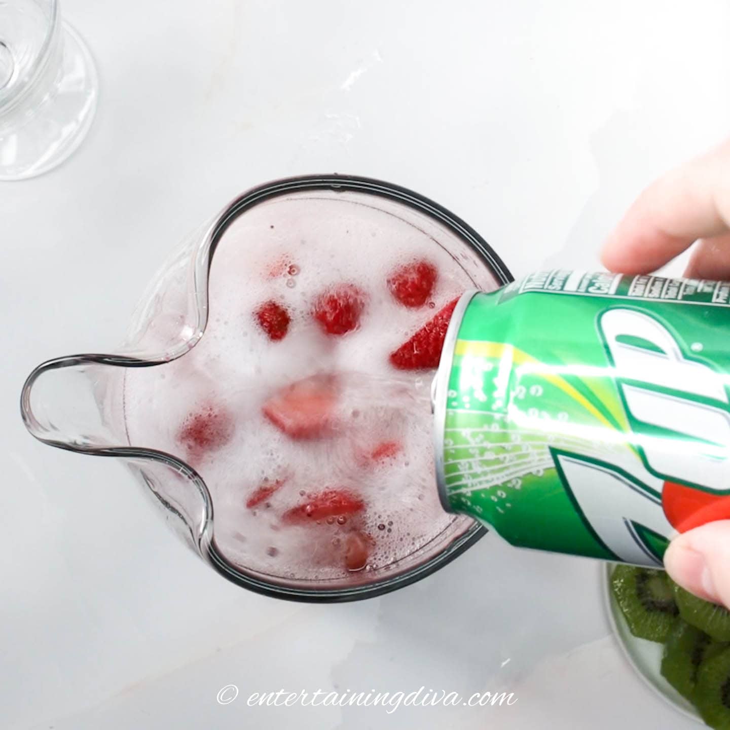 7-Up being poured into a pitcher of Sangria