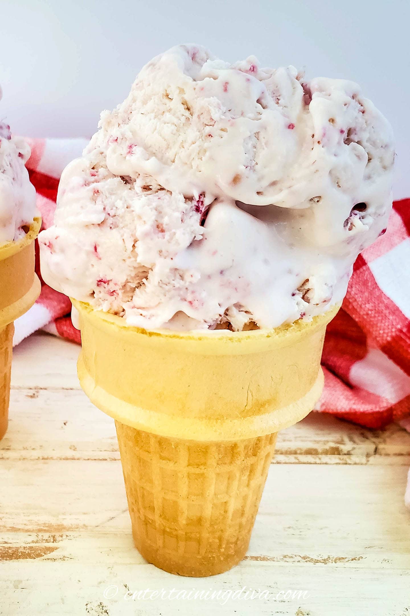 no churn raspberry ice cream in an ice cream cone