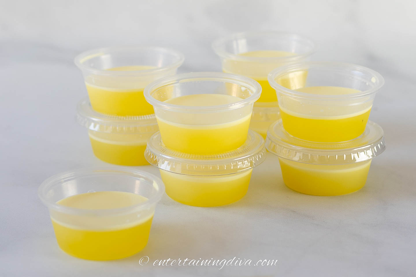 A stack of creamy piña colada jello shots