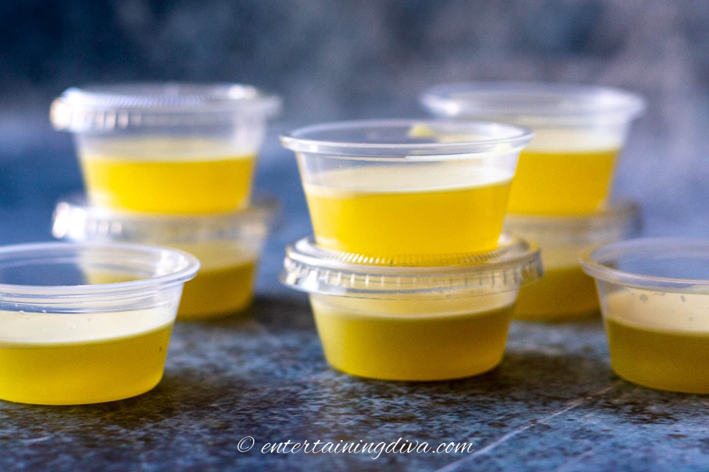 creamy piña colada jello shots in jello shot cups