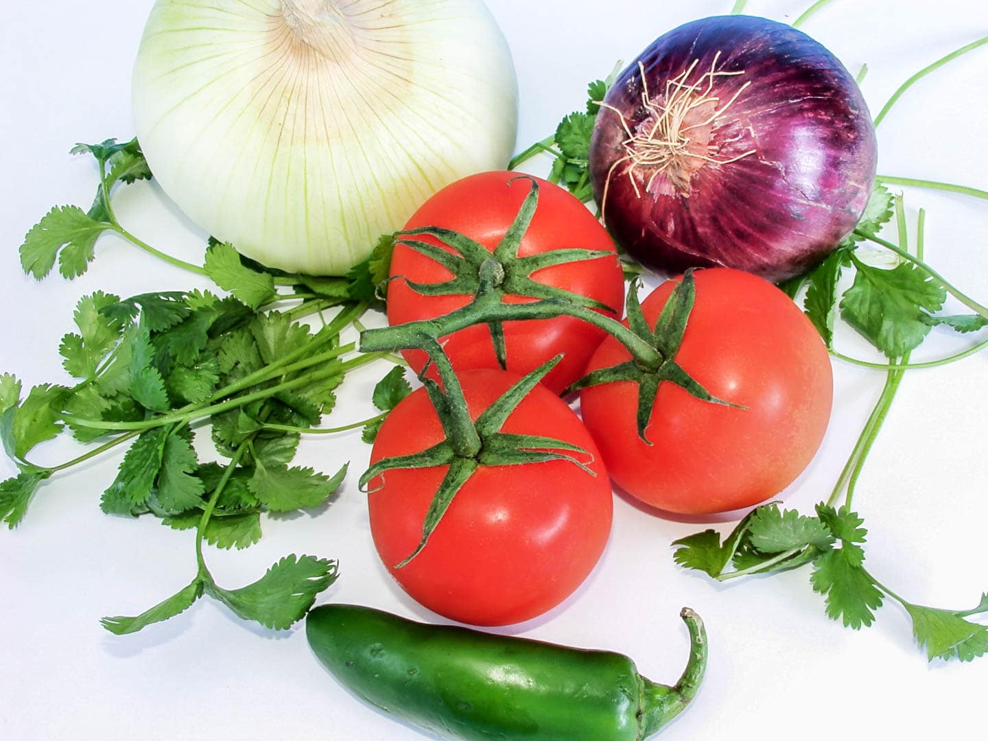 pico de gallo ingredients - onions, tomatoes, chile pepper, fresh cilantro