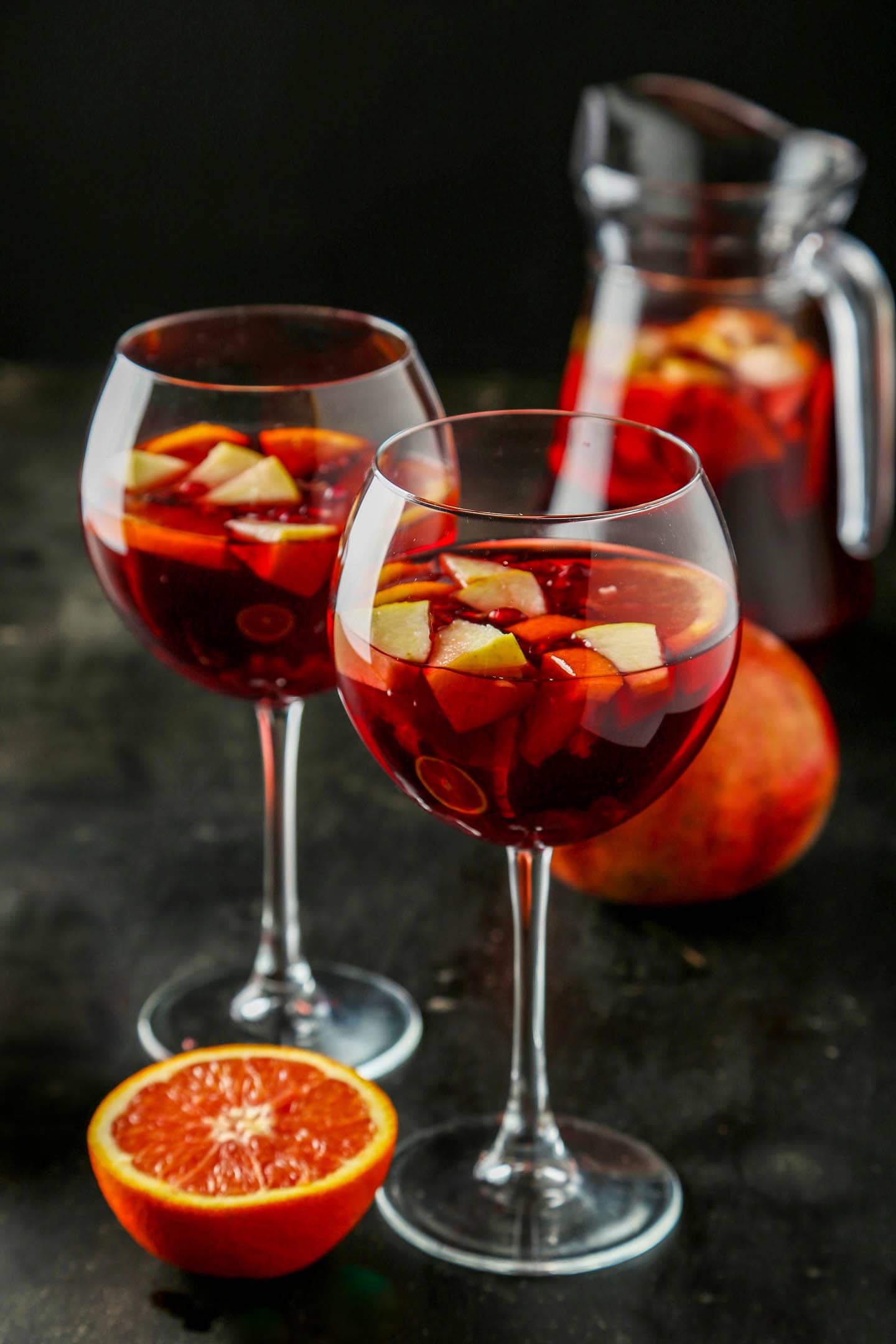 Two wine glasses filled with fruit and red wine sangria