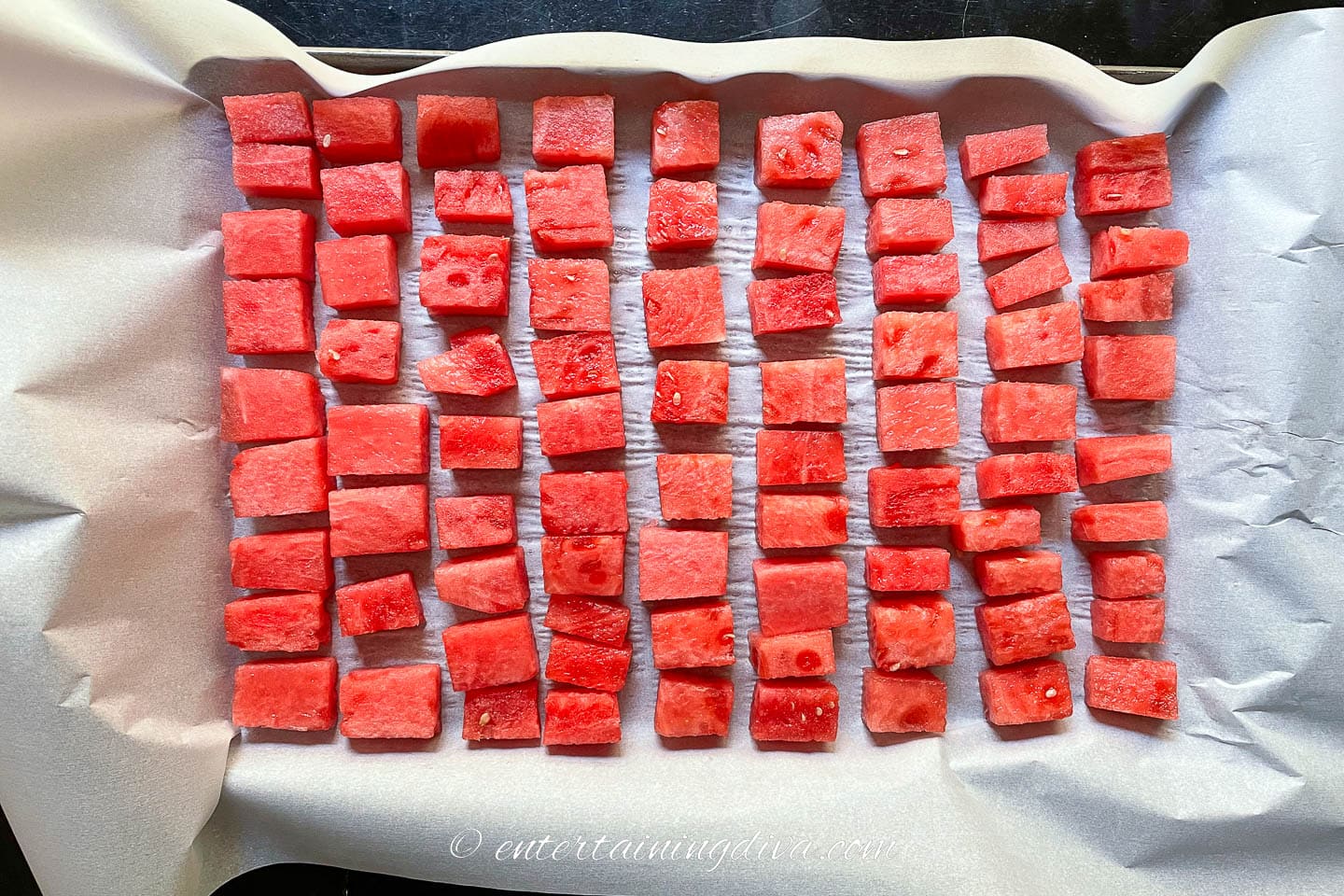 watermelon cubes on a baking sheet
