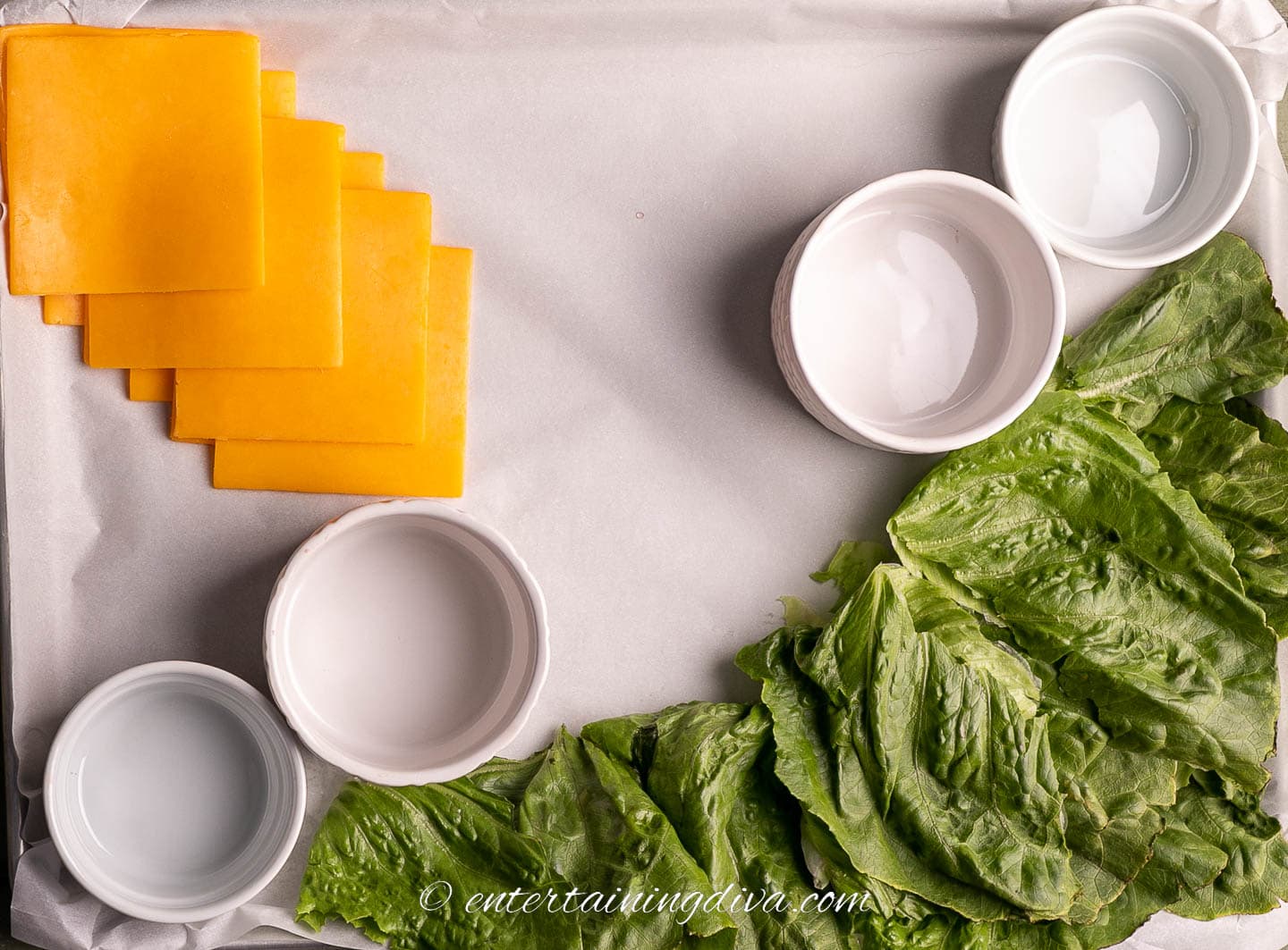 how to make a burger toppings charcuterie board step 3: bowls, lettuce and cheese