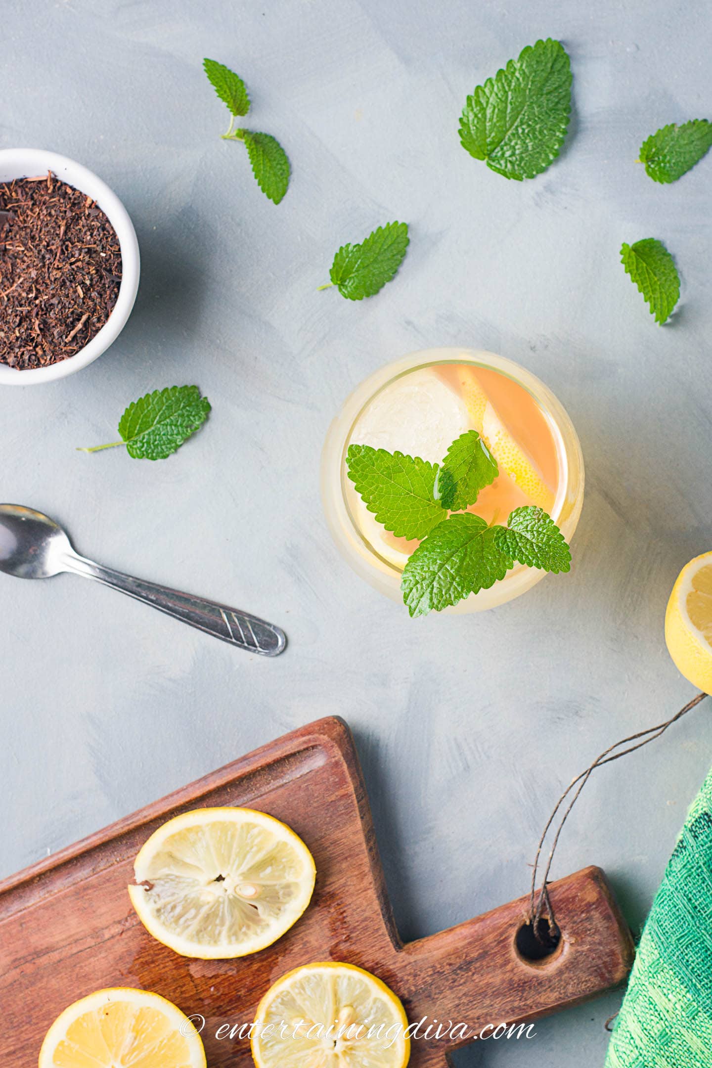 Overhead picture of a glass of iced tea with mint and lemon slices