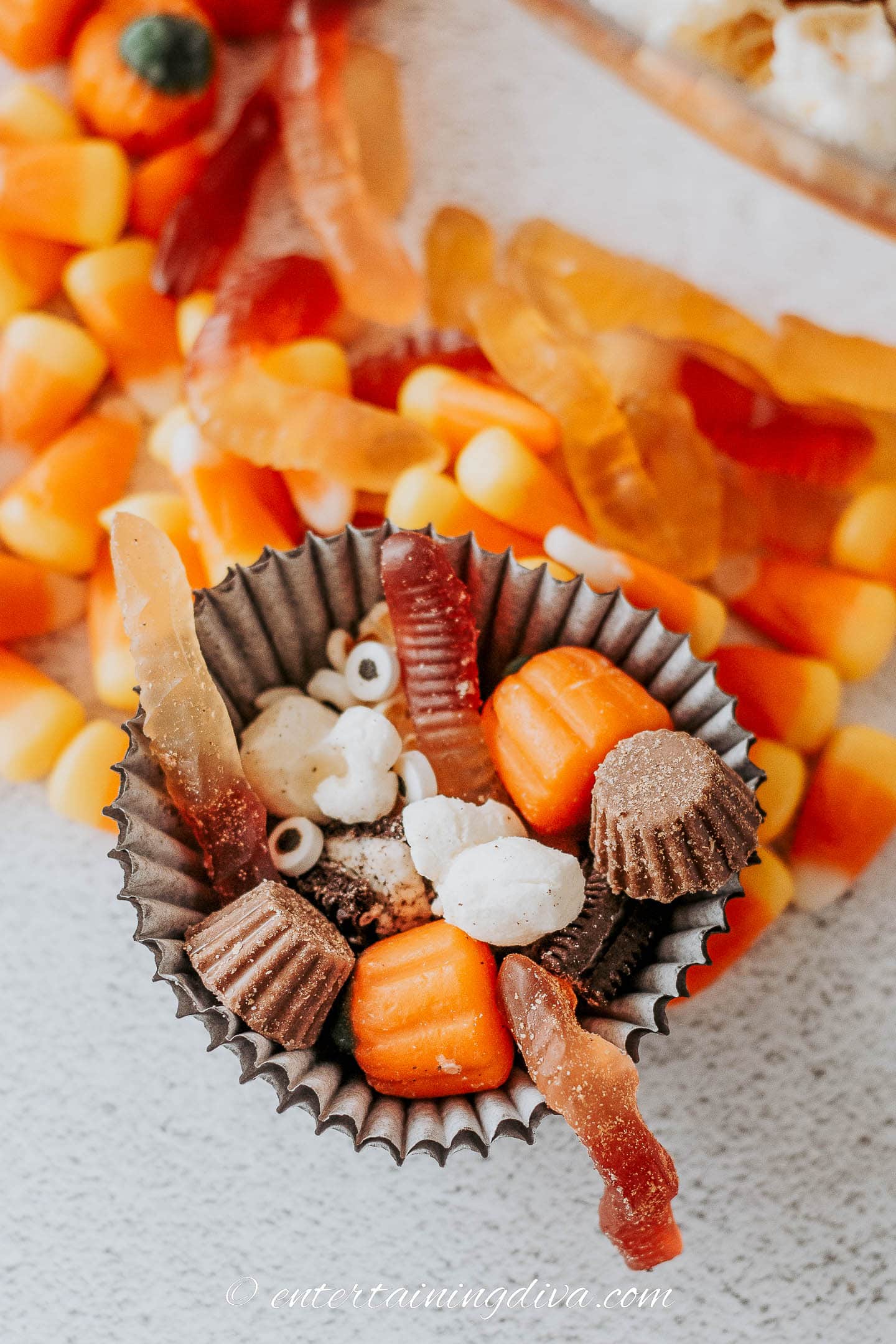 Halloween snack mix served in a cupcake wrapper