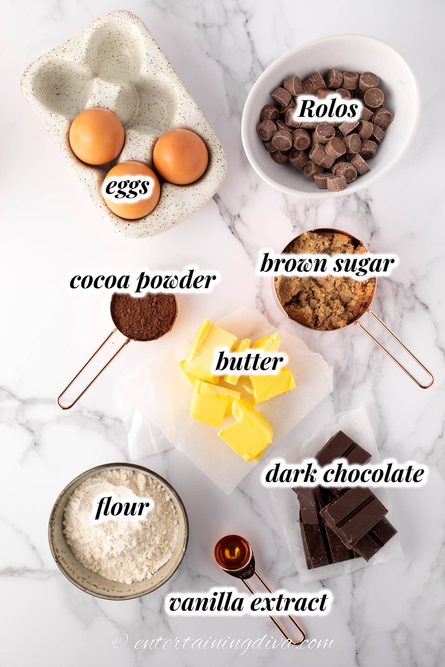 Rolo brownie ingredients - eggs, Rolos, cocoa powder, brown sugar, butter, flour, vanilla extract, dark chocolate