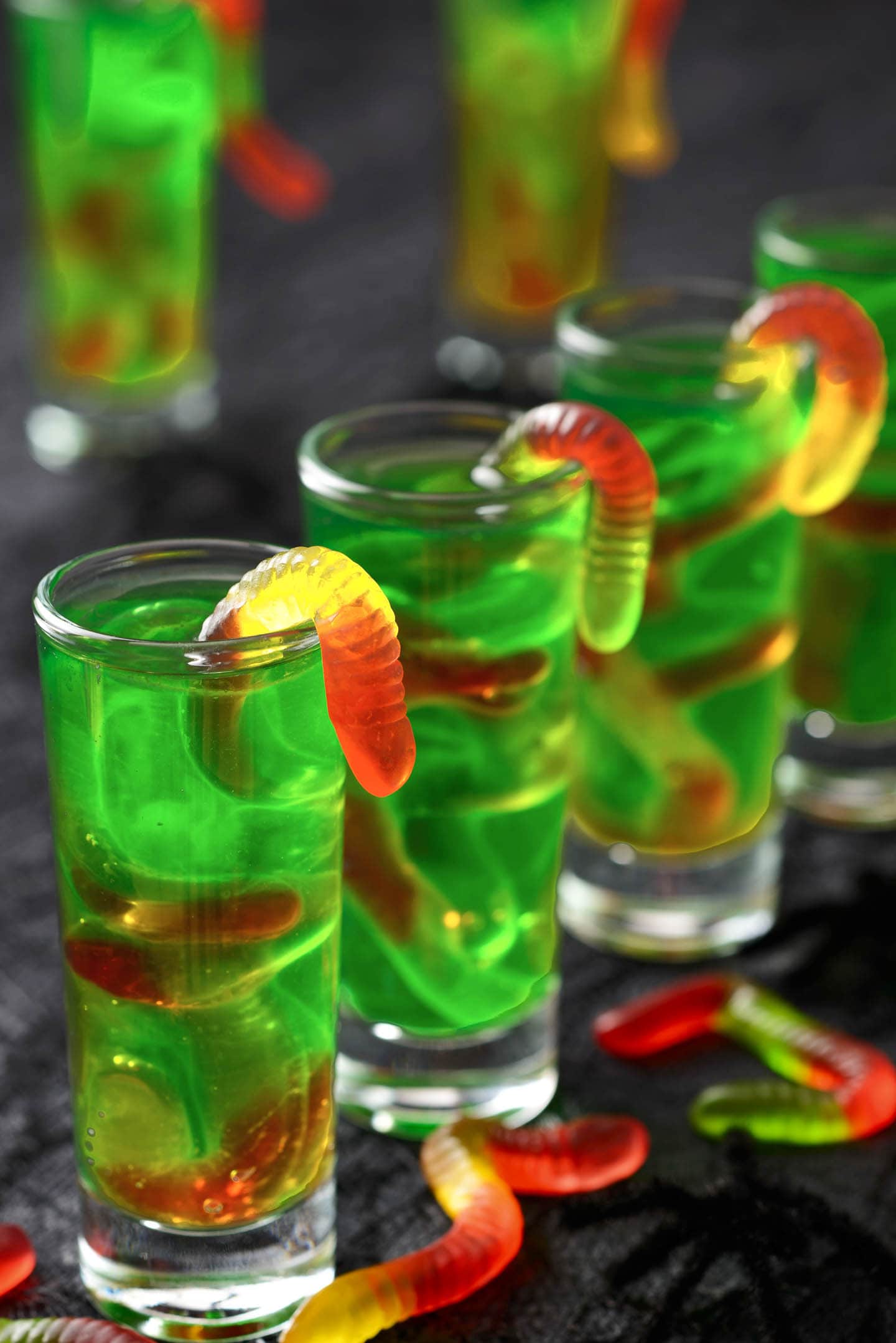 Green Halloween Jello shots with gummy worms