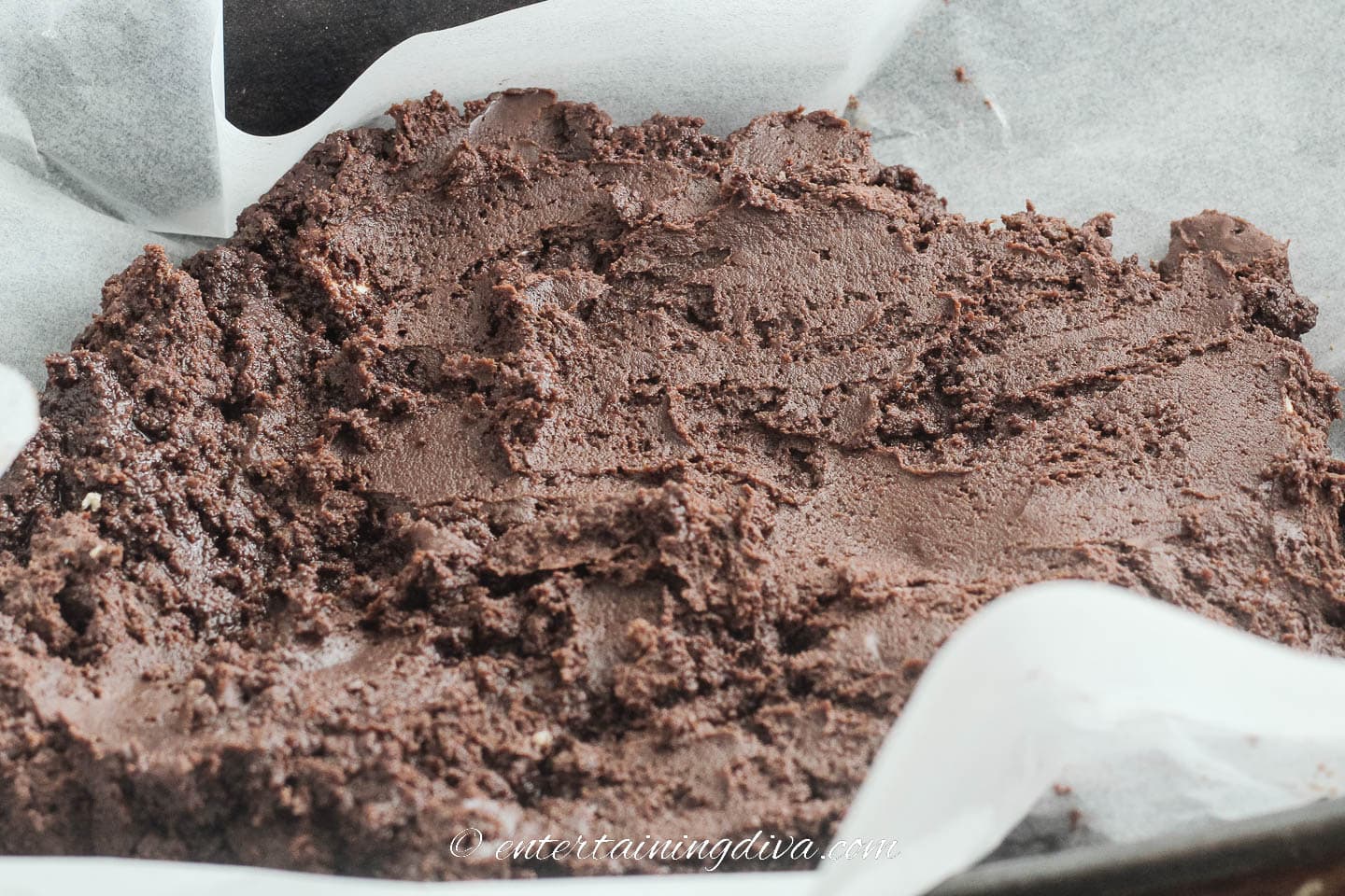 chocolate cream cheese fudge in a baking pan