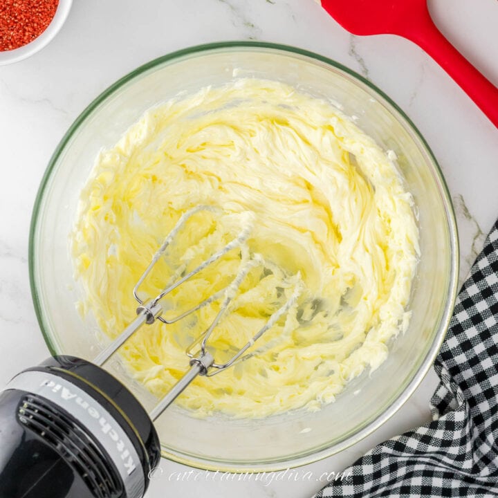 whipped butter in a bowl with a mixer