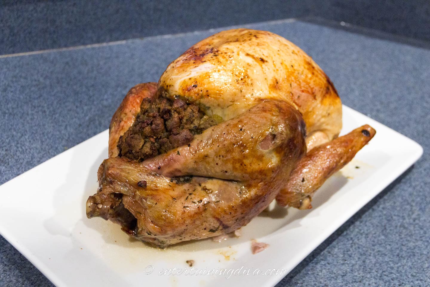 stuffed roasted turkey on a platter 