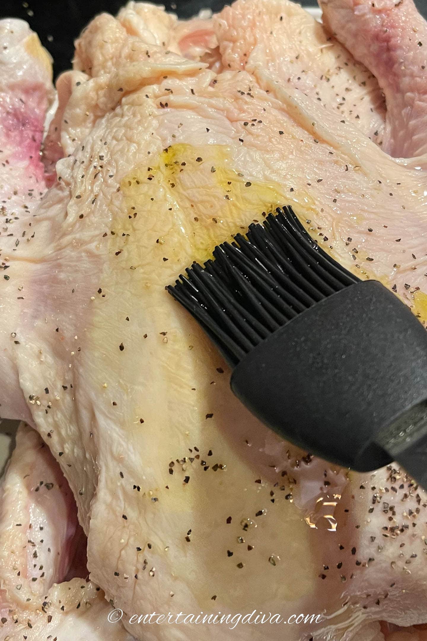 Brushing oil on a turkey