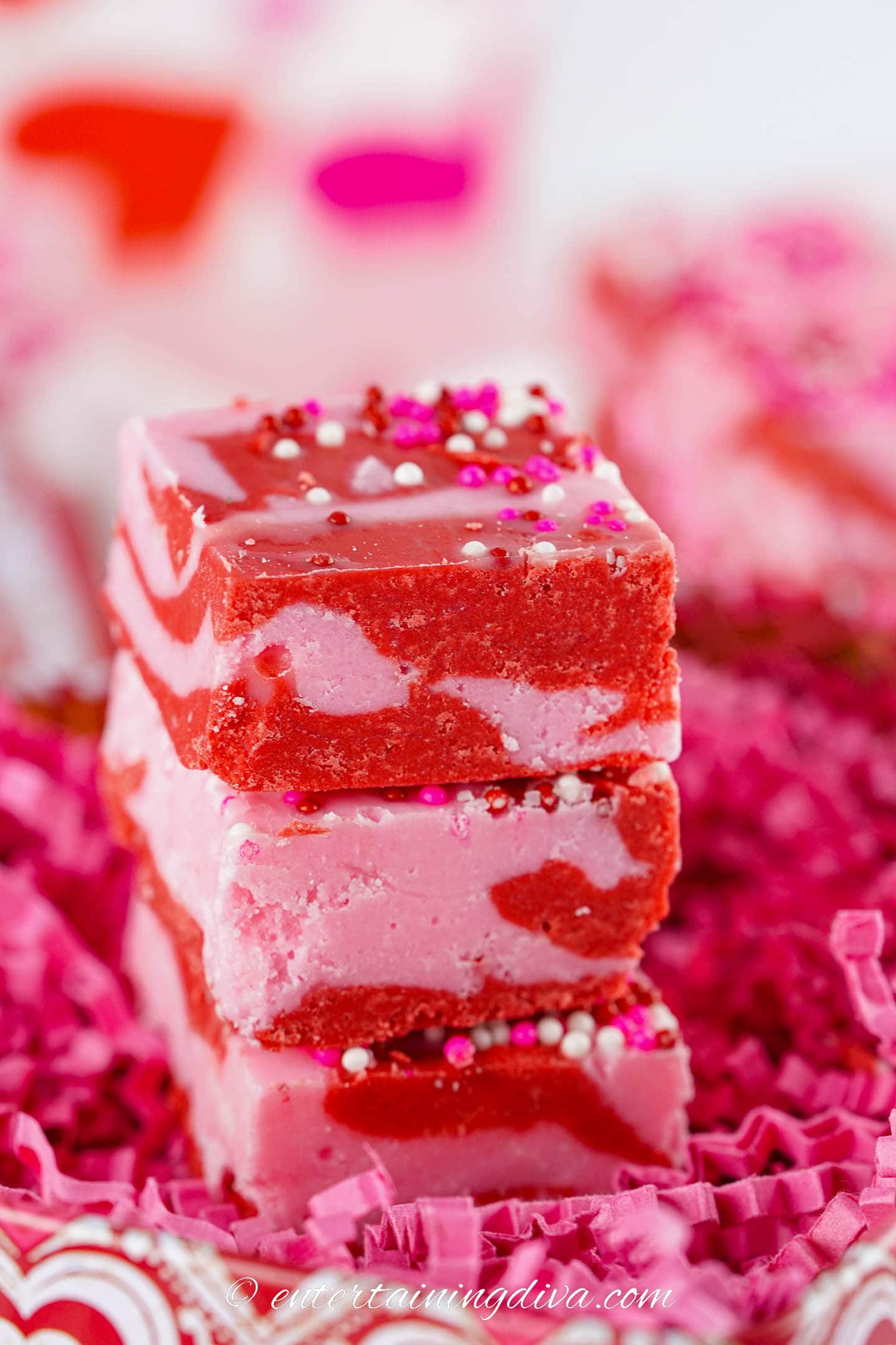 a stack of 3 pieces of homemade strawberry fudge