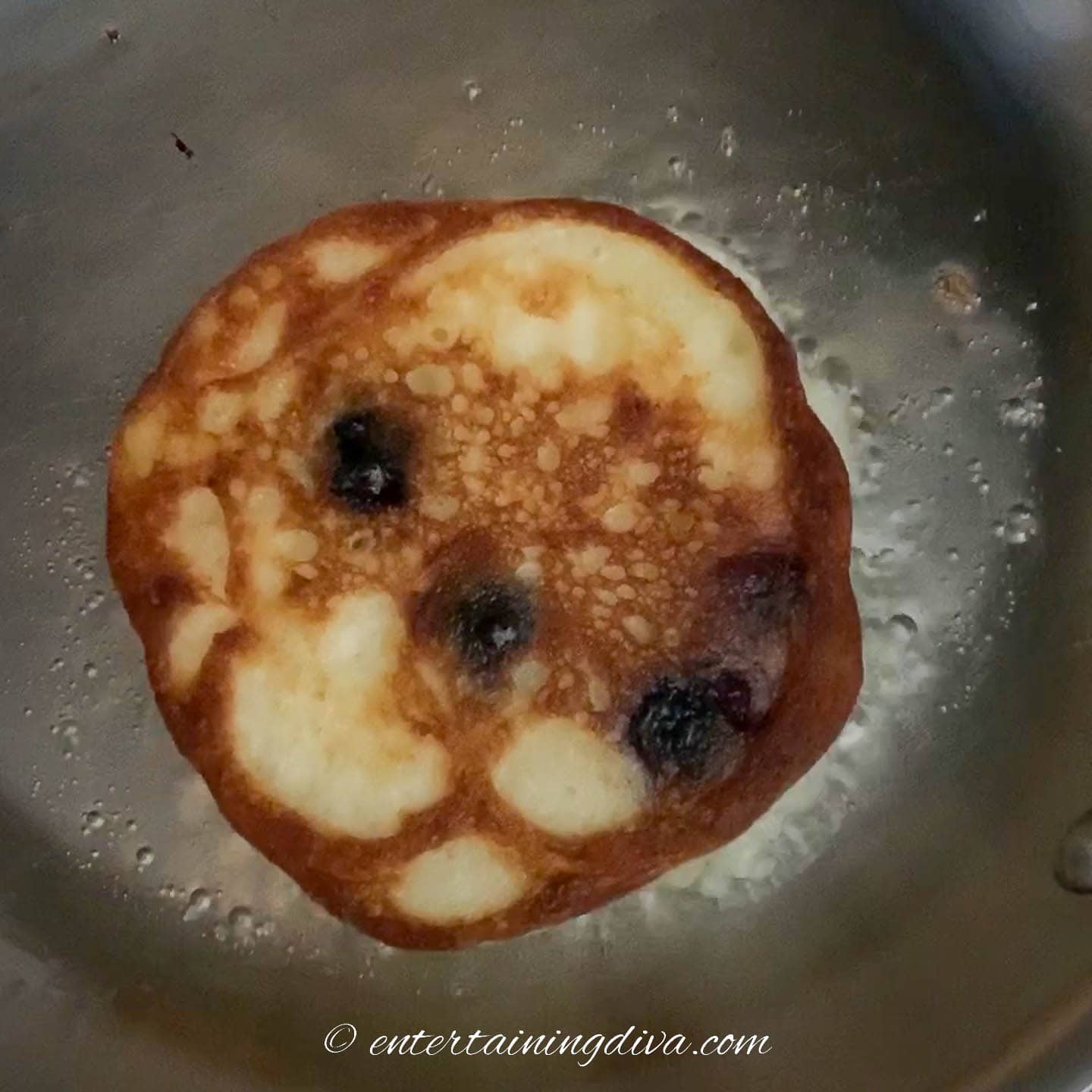 Pancake in a pan after it has been flipped