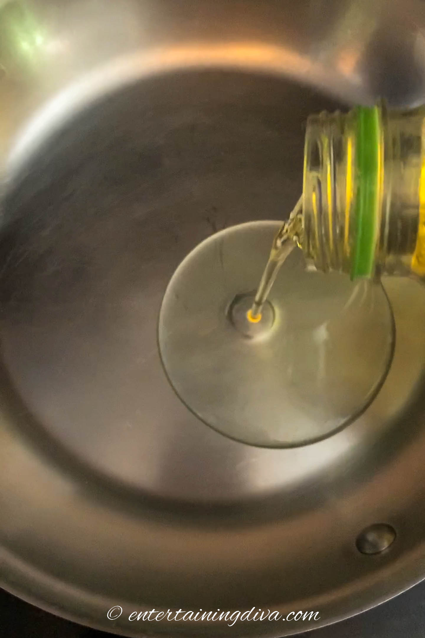 vegetable oil being poured into a frying pan