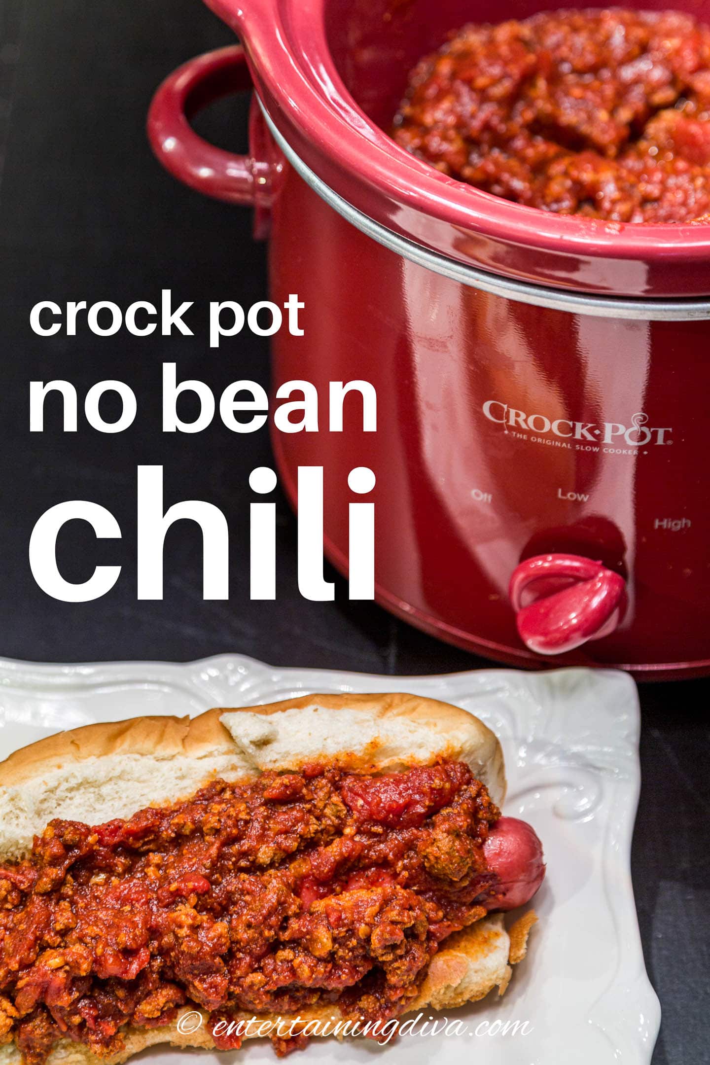 crock pot no bean chili on a hot dog in front of a slow cooker