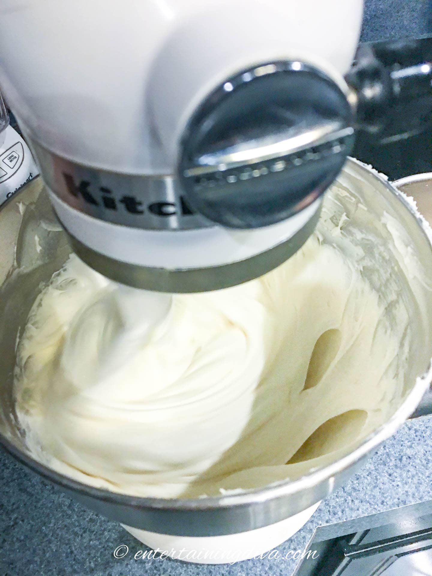 Cheesecake batter being mixed in a bowl