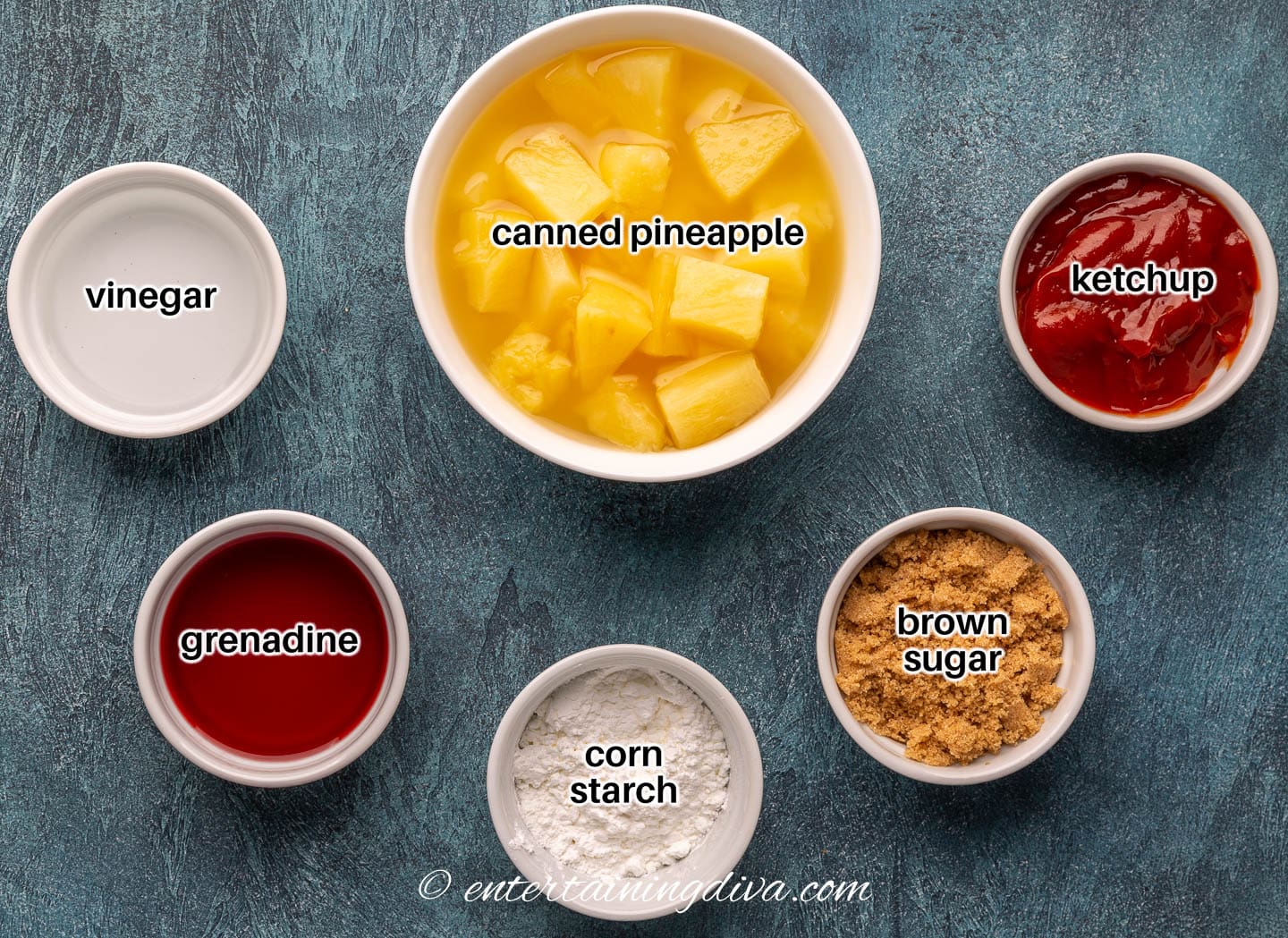 Ingredients for sweet and sour sauce - canned pineapple chunks, ketchup, brown sugar, corn starch, grenadine and vinegar
