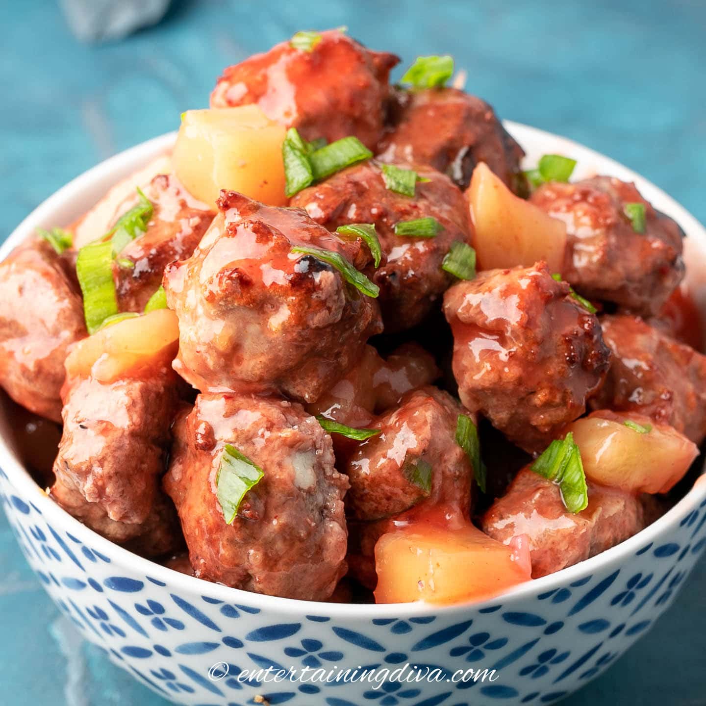 sweet and sour meatballs with pineapple in a bowl