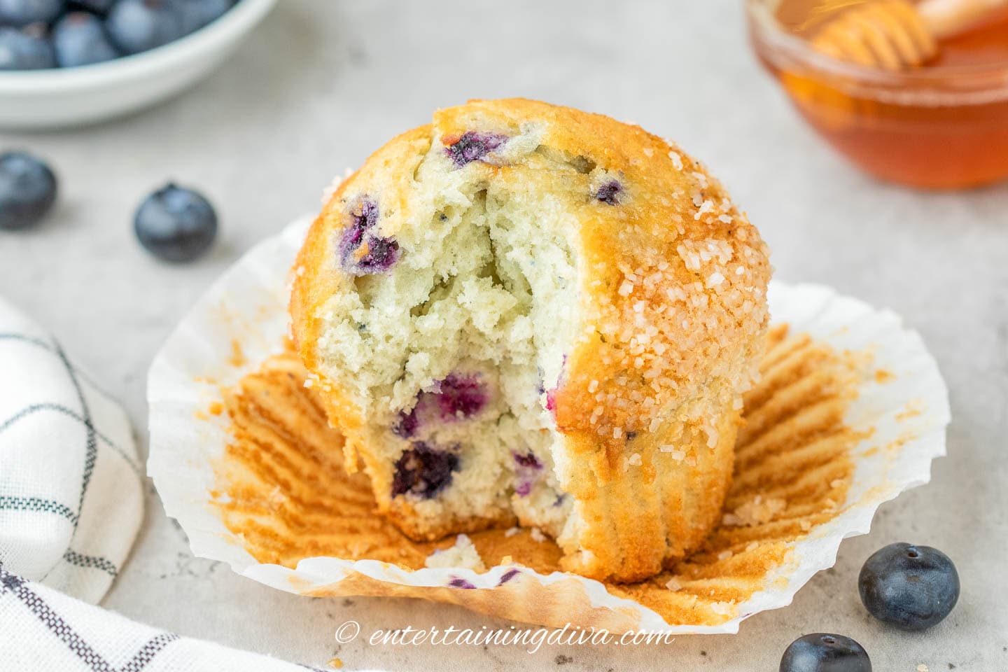 Homemade blueberry muffin with a bite out of it