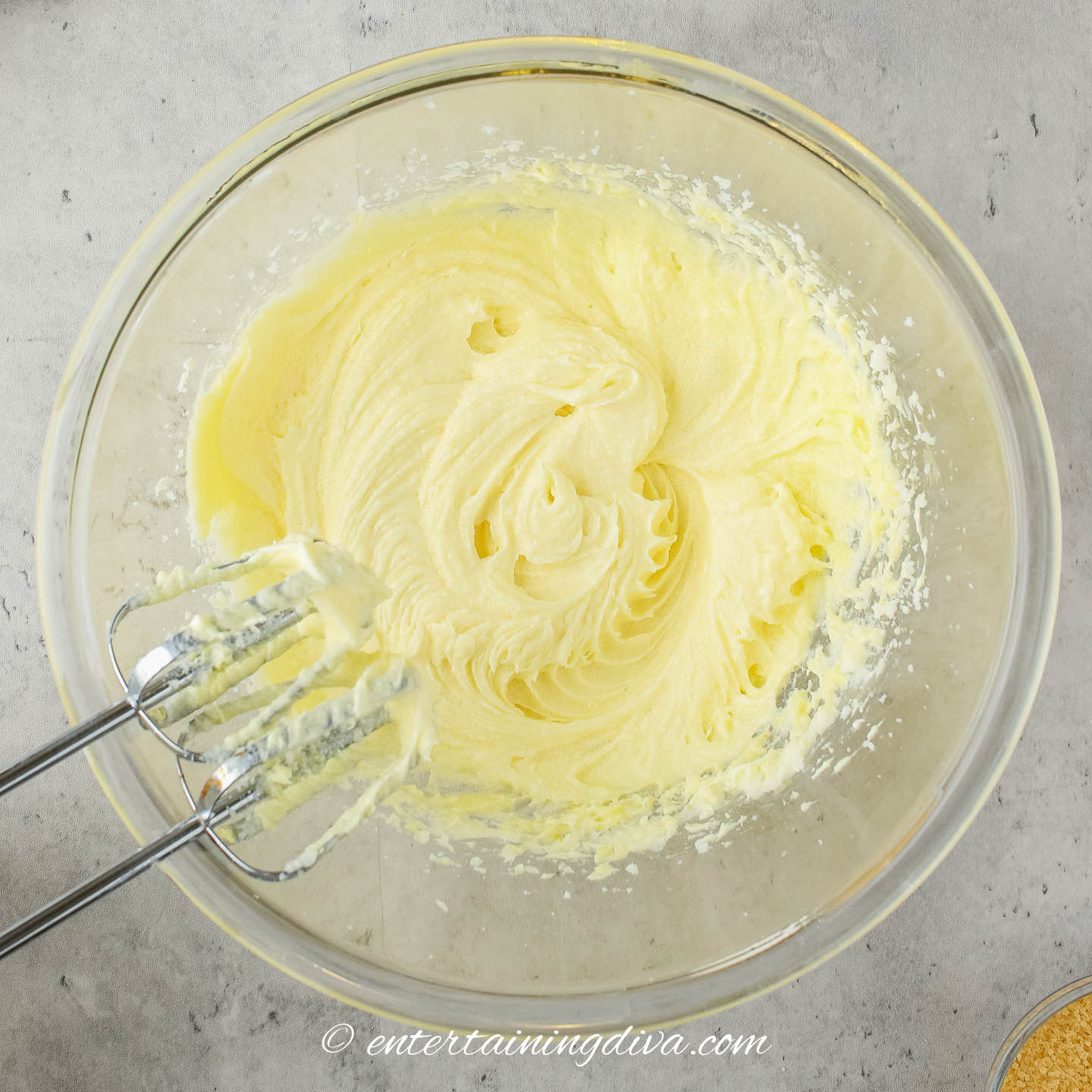 butter, sugar, vanilla, honey and milk mixed in a bowl