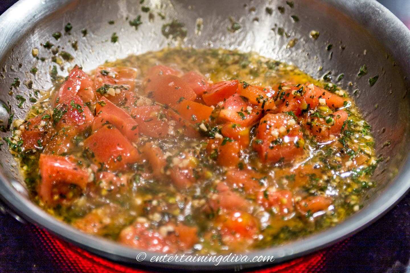 tomatoes and spices in the skillet after being cooked