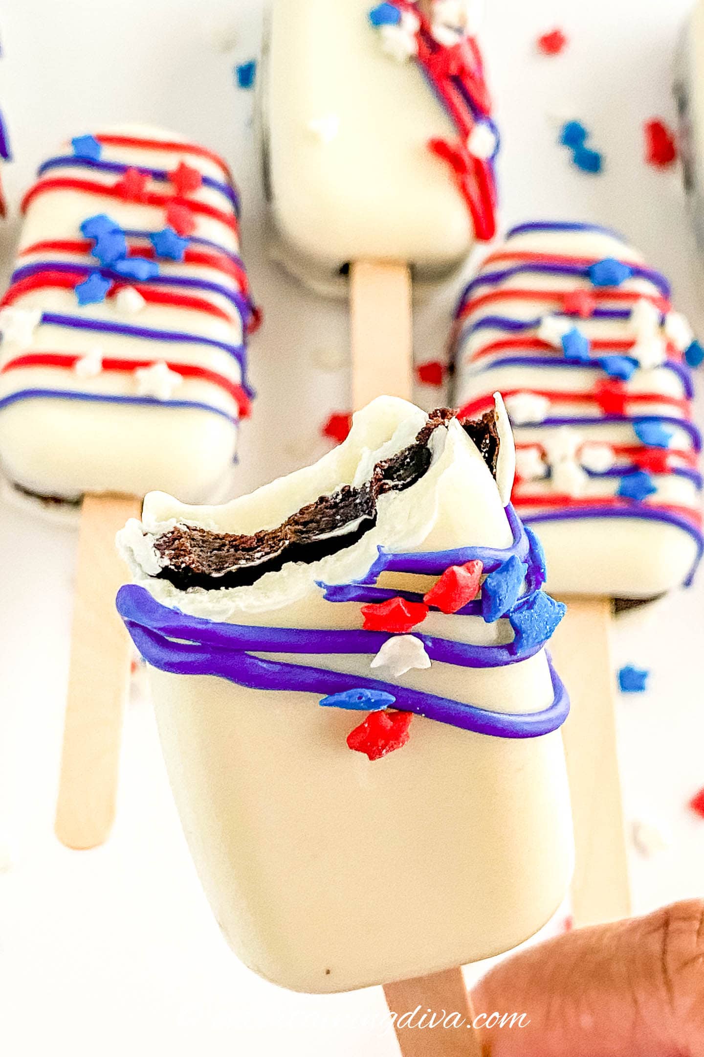 4th of July cakesicle with a bite out of it