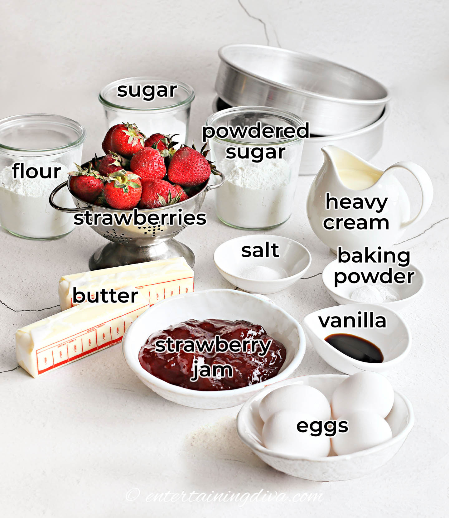 strawberry shortcake cake ingredients - fresh strawberries, flour, sugar, baking powder, butter, vanilla, eggs, salt, powdered sugar, heavy cream