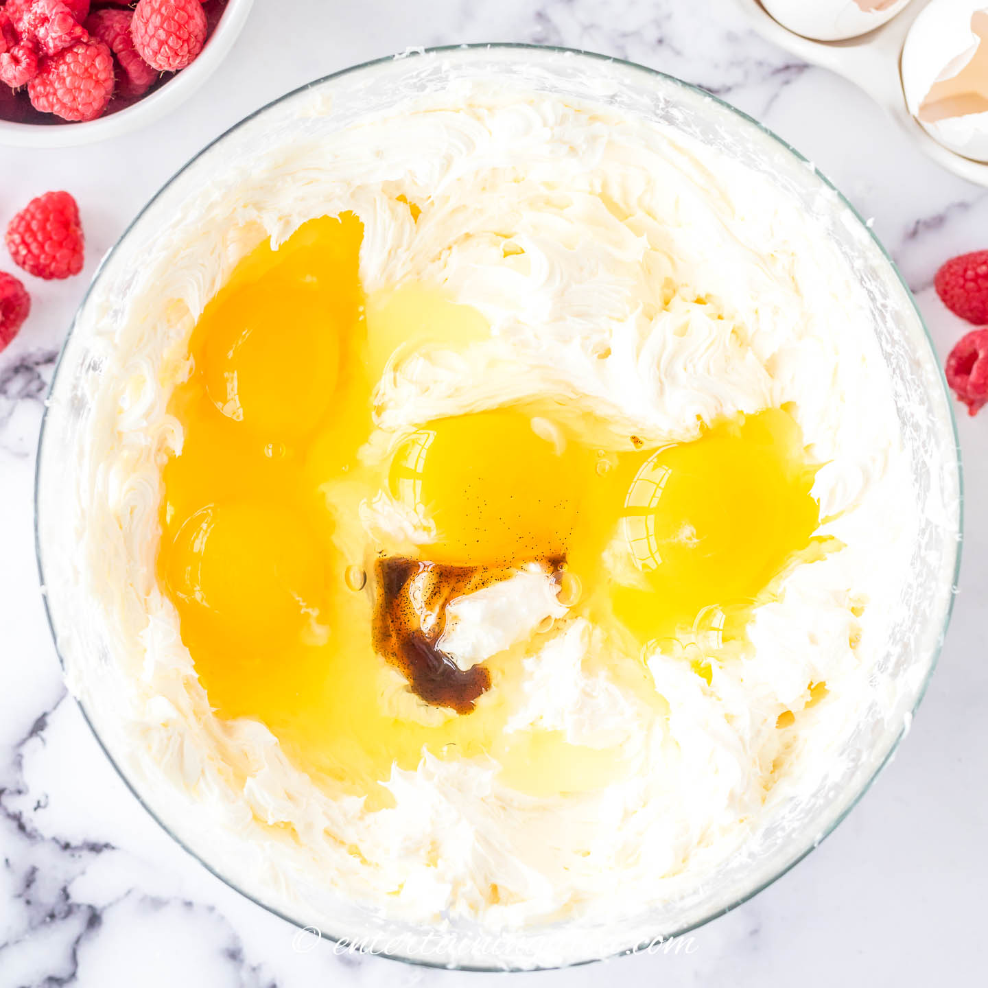 cream cheese, eggs and vanilla in a mixing bowl