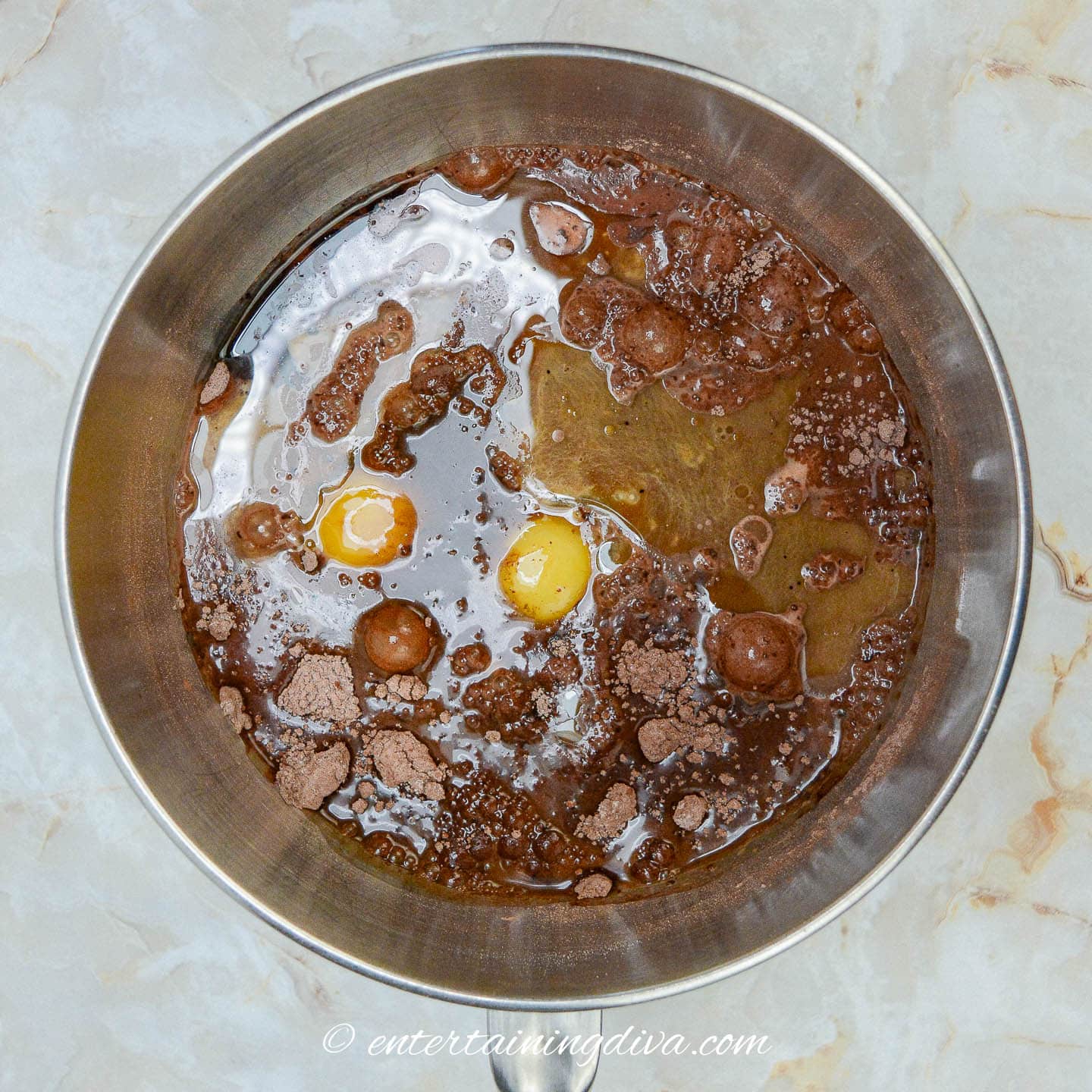 Chocolate cupcake ingredients including eggs in a mixing bowl