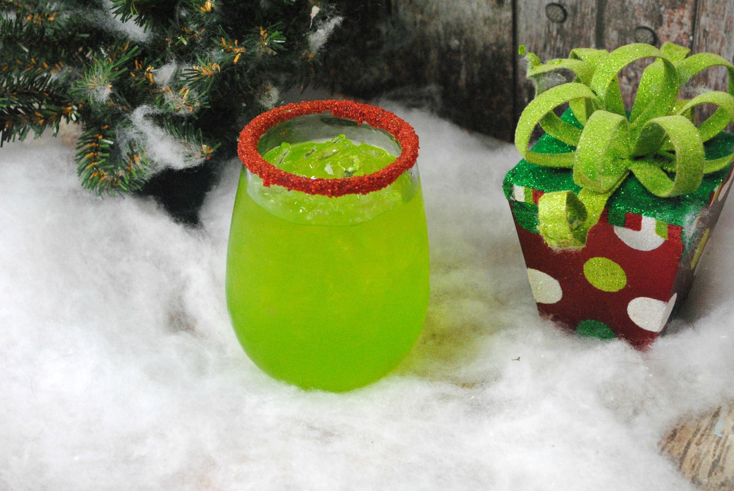 green Grinch cocktail with a red rim