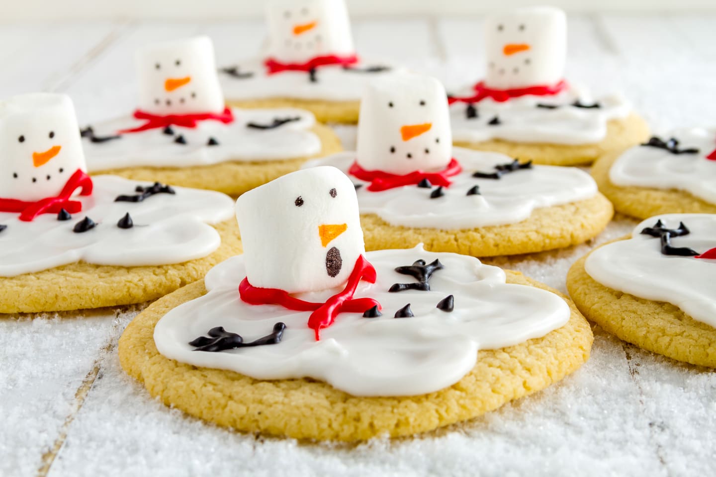 Christmas sugar cookie snowman with icing and marshmallows.